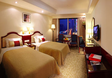 Guest room at the Ramada Plaza by Wyndham Tian Lu Hotel Wuhan in Wuhan, Other than US/Canada