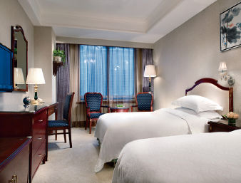 Guest room at the Ramada Plaza by Wyndham Tian Lu Hotel Wuhan in Wuhan, Other than US/Canada