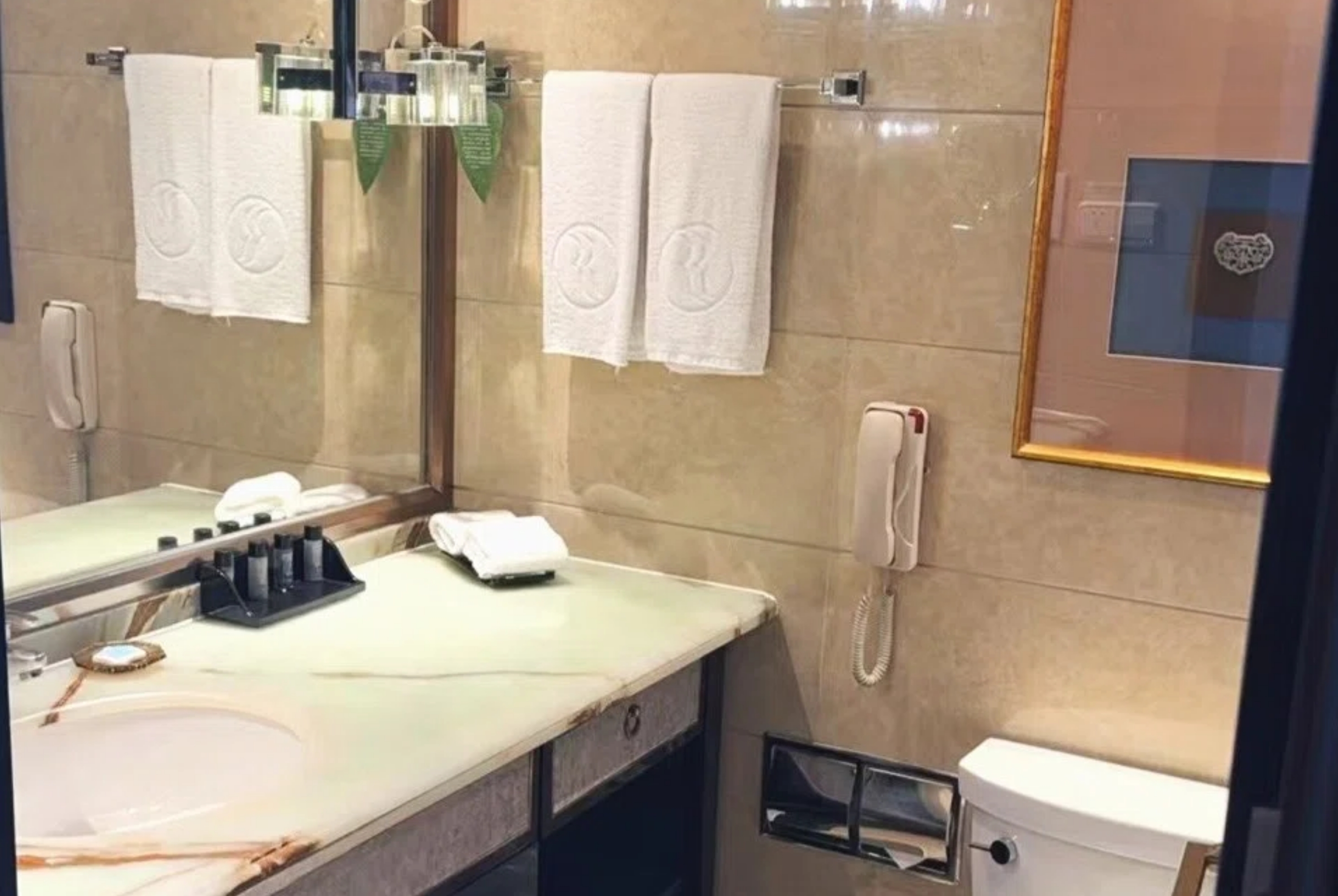 Guest room bath at the Ramada Plaza by Wyndham Tian Lu Hotel Wuhan in Wuhan, Other than US/Canada