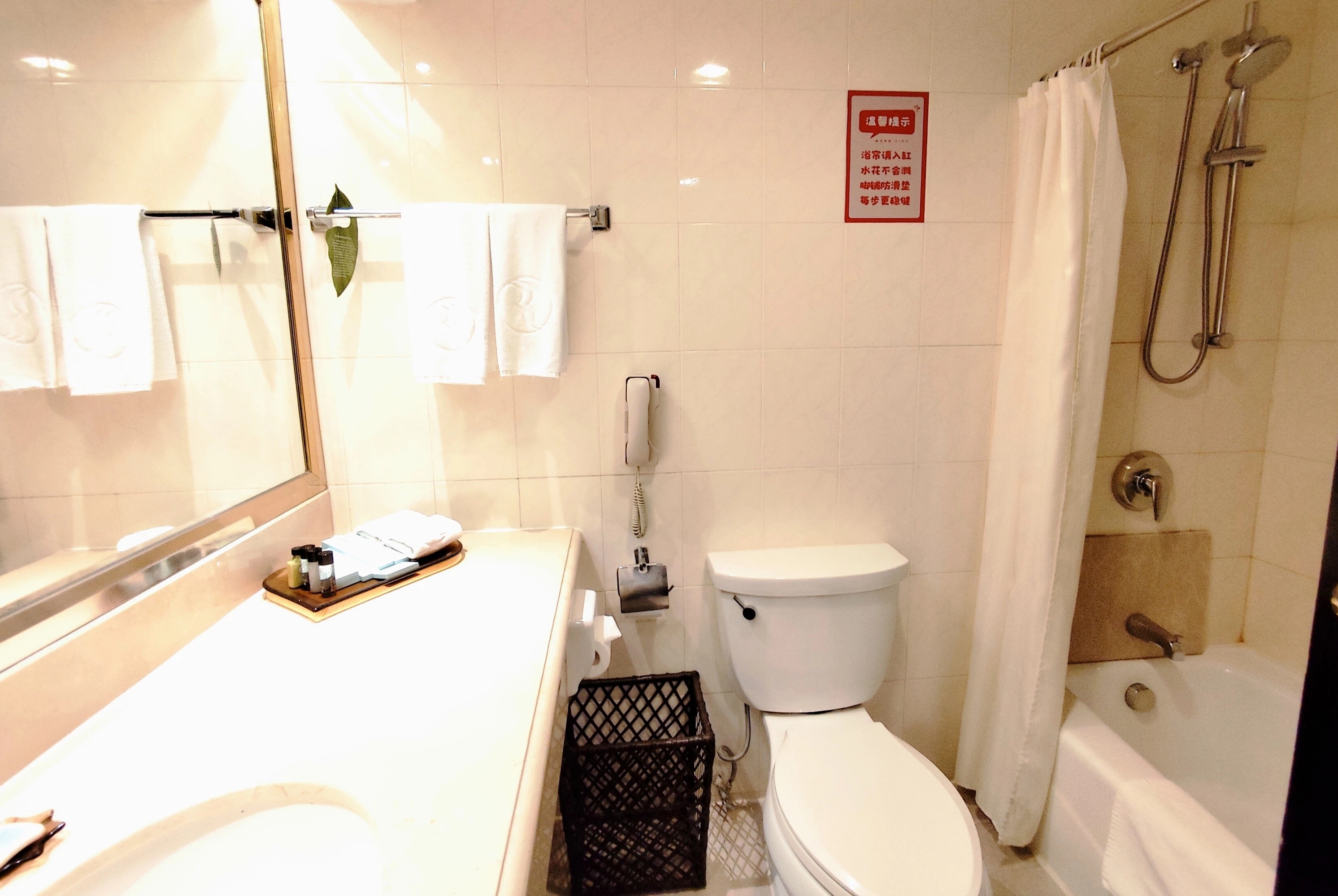 Guest room bath at the Ramada Plaza by Wyndham Tian Lu Hotel Wuhan in Wuhan, Other than US/Canada