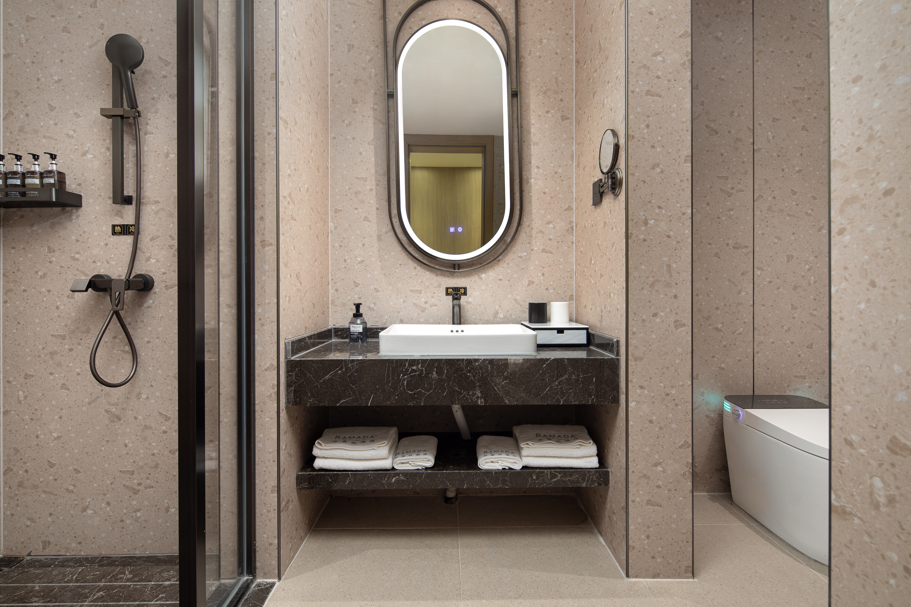 Guest room bath at the Ramada by Wyndham Wuhan Wangjiawan in Wuhan, Other than US/Canada