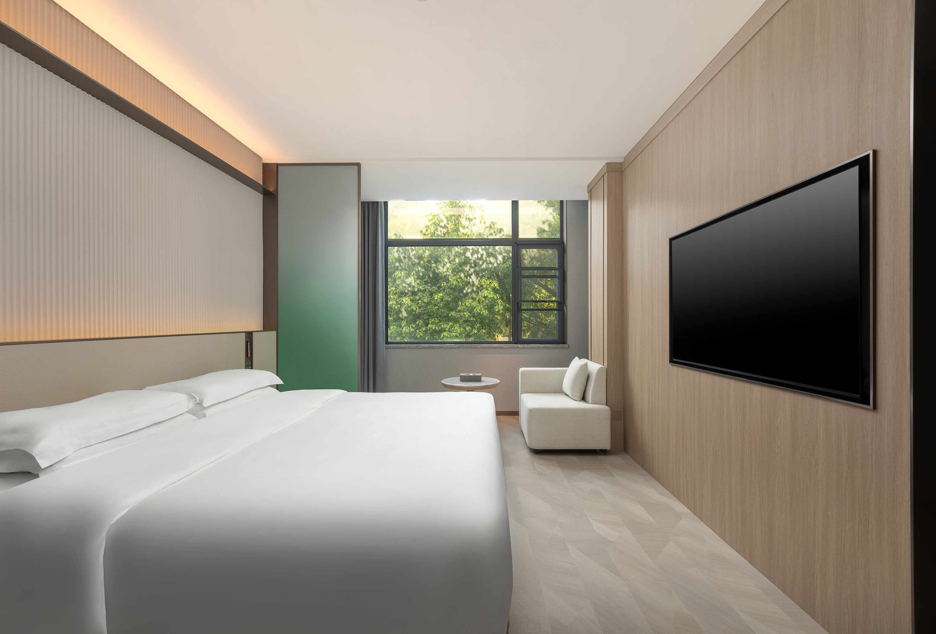 Guest room at the Ramada Encore by Wyndham Wuhan Downtown in Wuhan, Other than US/Canada