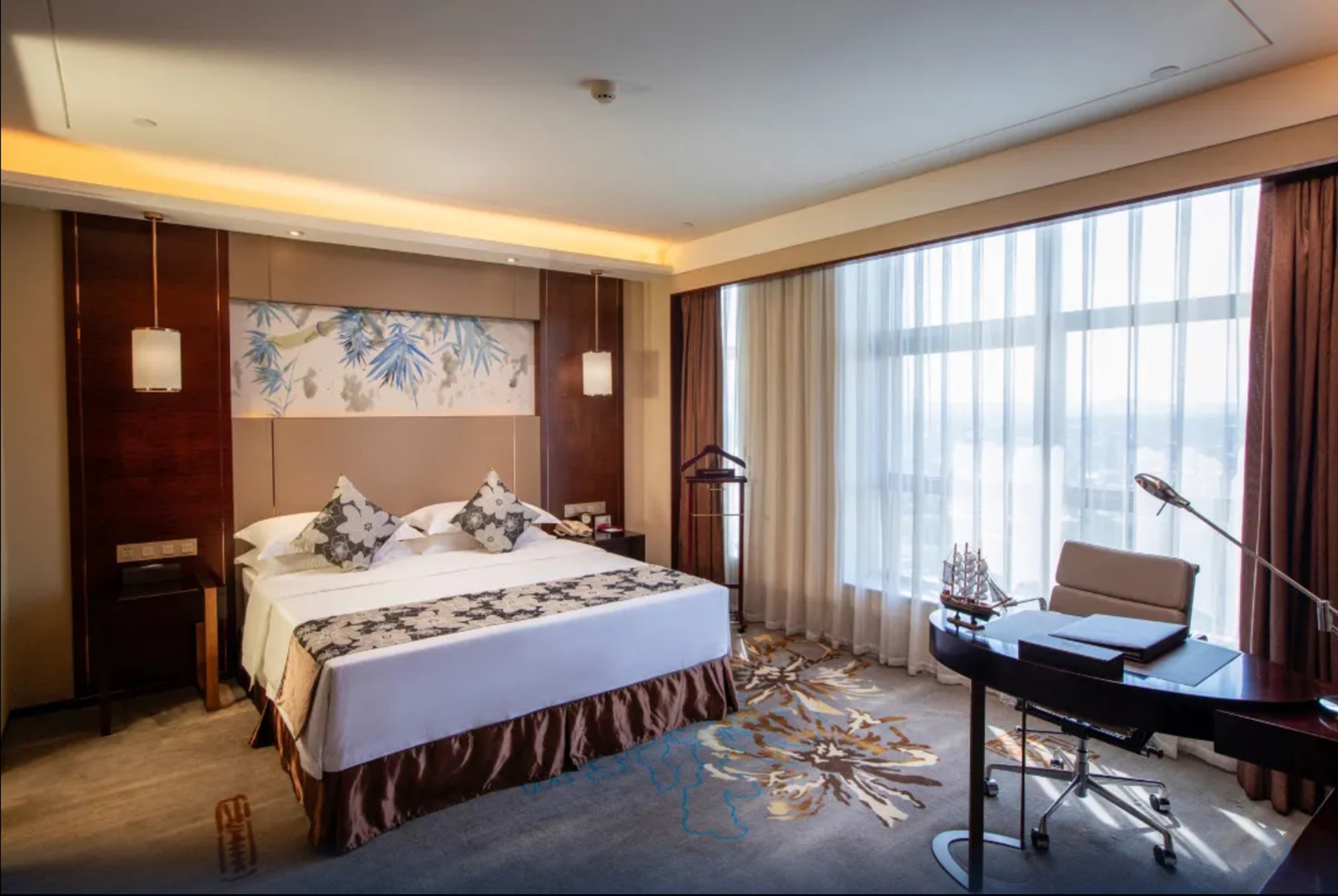 Guest room at the Ramada by Wyndham Yiyang Taojiang in Yiyang, Other than US/Canada