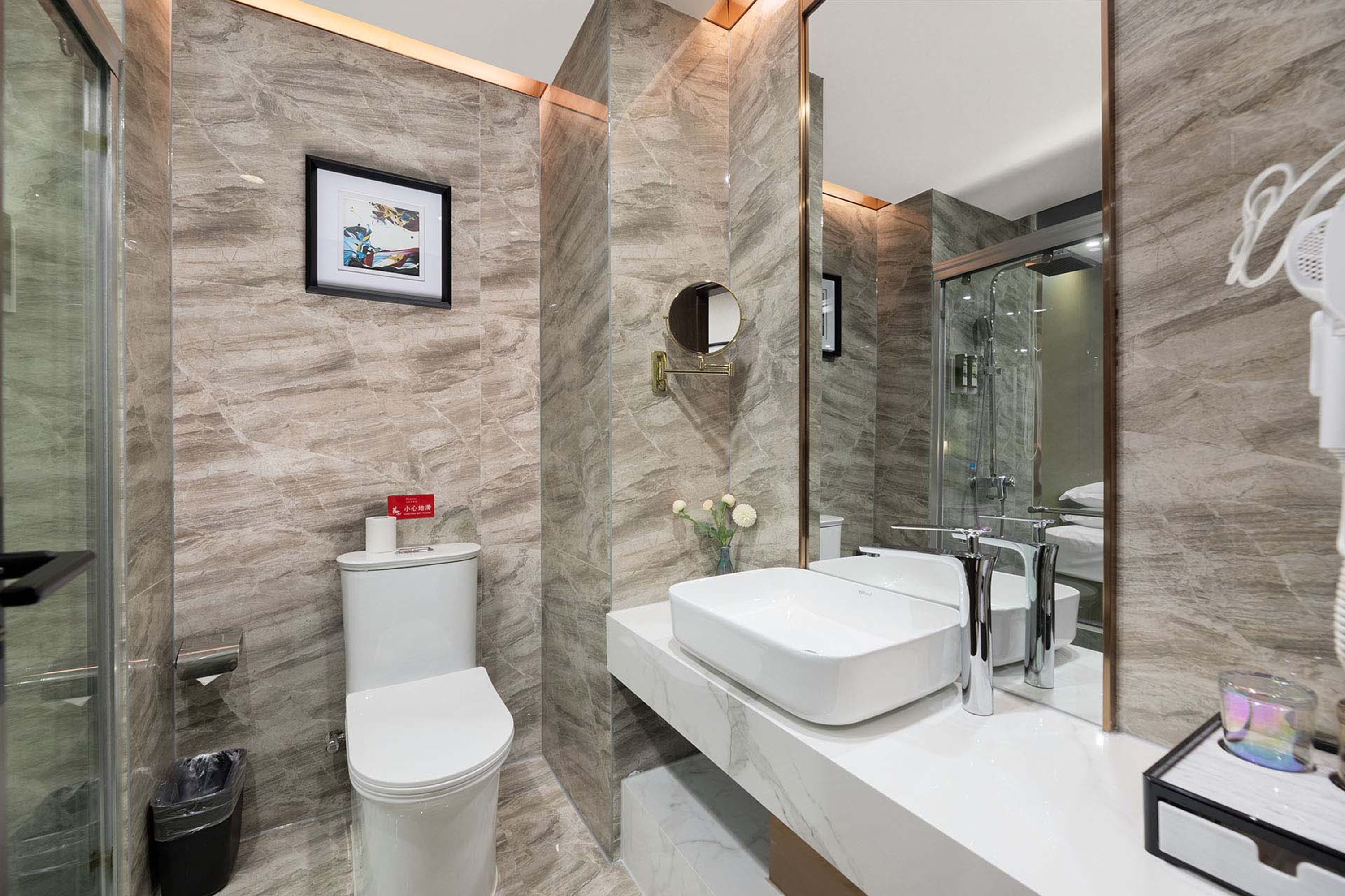 Guest room bath at the Ramada by Wyndham Zhangjiajie in Zhangjiajie, Other than US/Canada