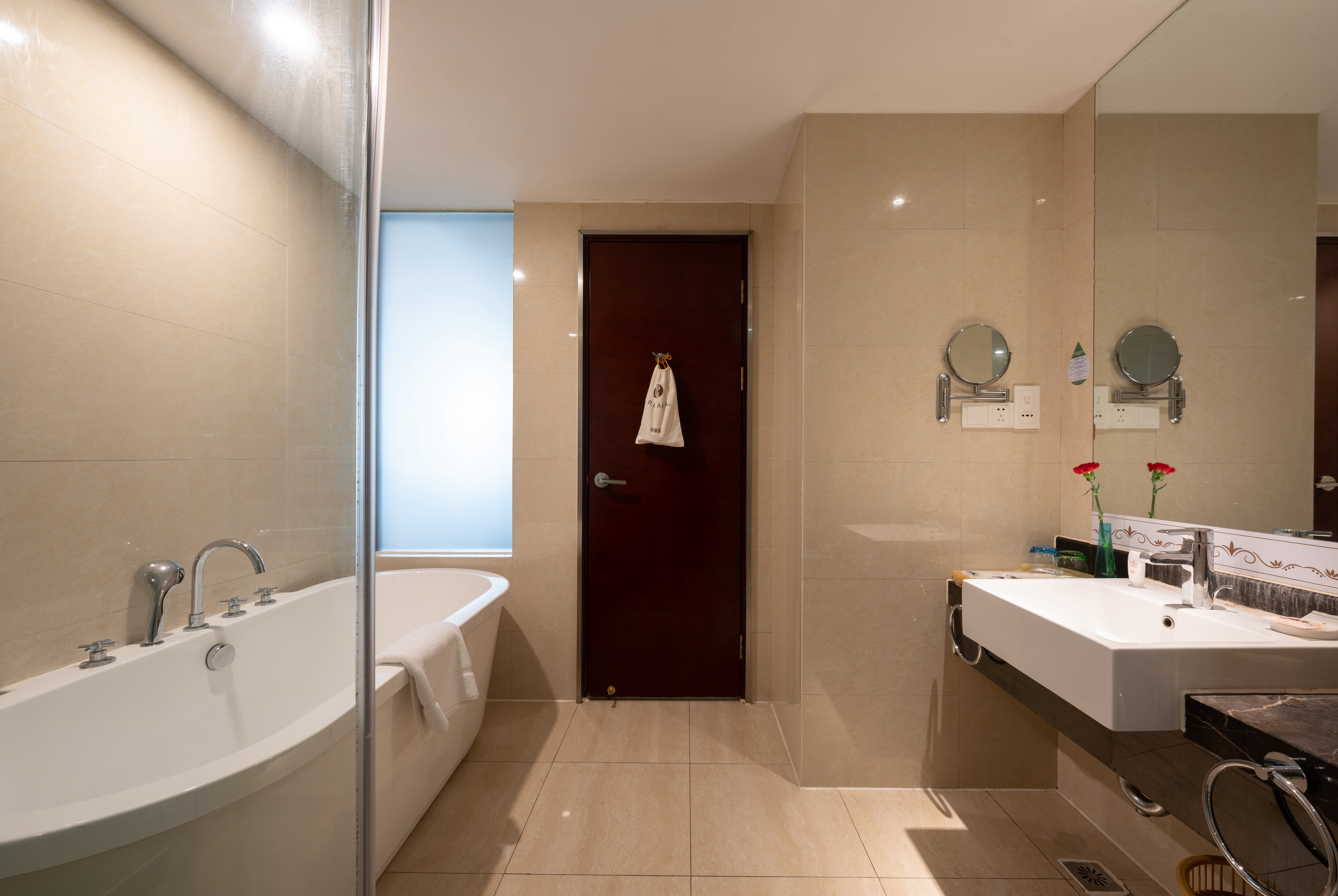 Guest room bath at the Ramada by Wyndham Zibo in Zibo, Other than US/Canada