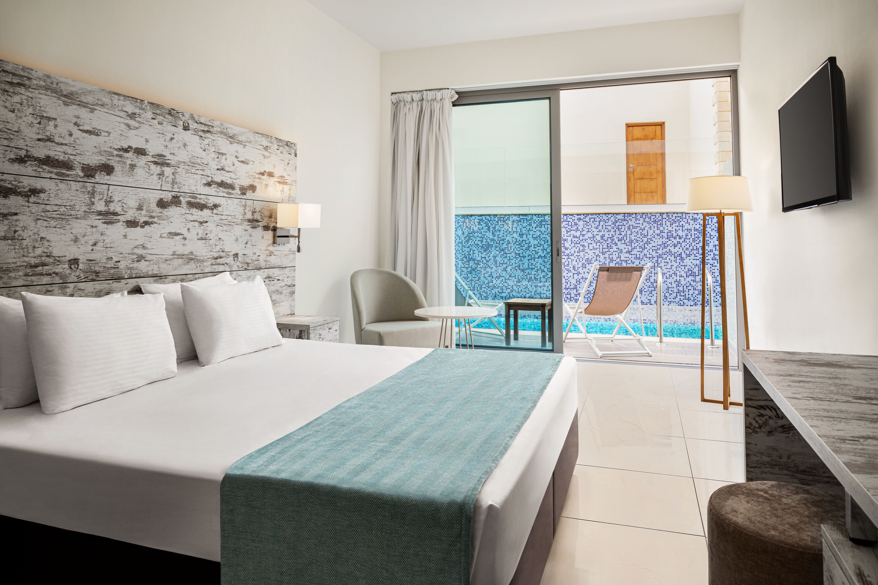 Guest room at the Ramada Hotel & Suites by Wyndham Ayia Napa in Famagusta, Other than US/Canada