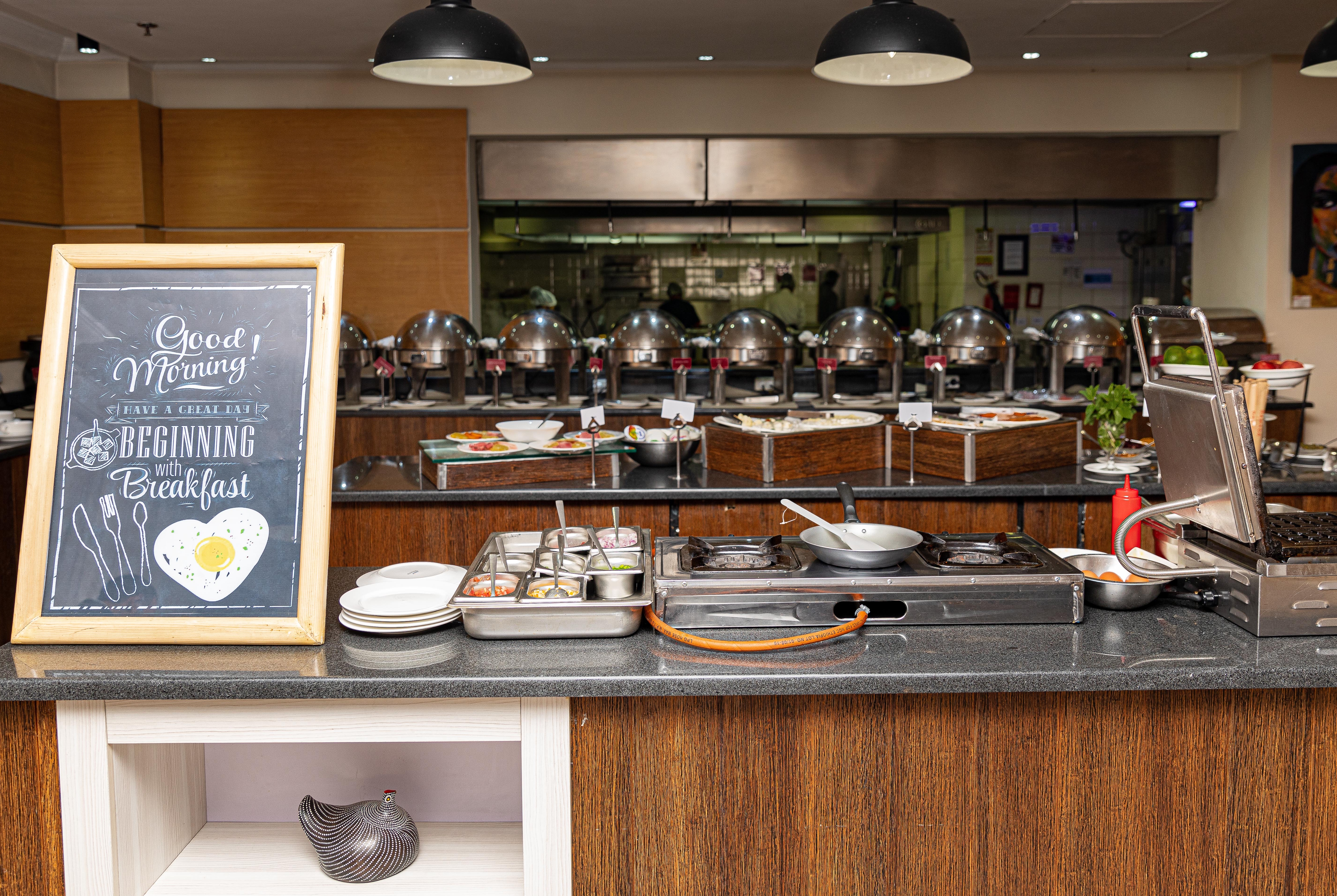 Ramada by Wyndham Addis Ababa restaurant breakfast area with seating in Addis Ababa, Other than US/Canada