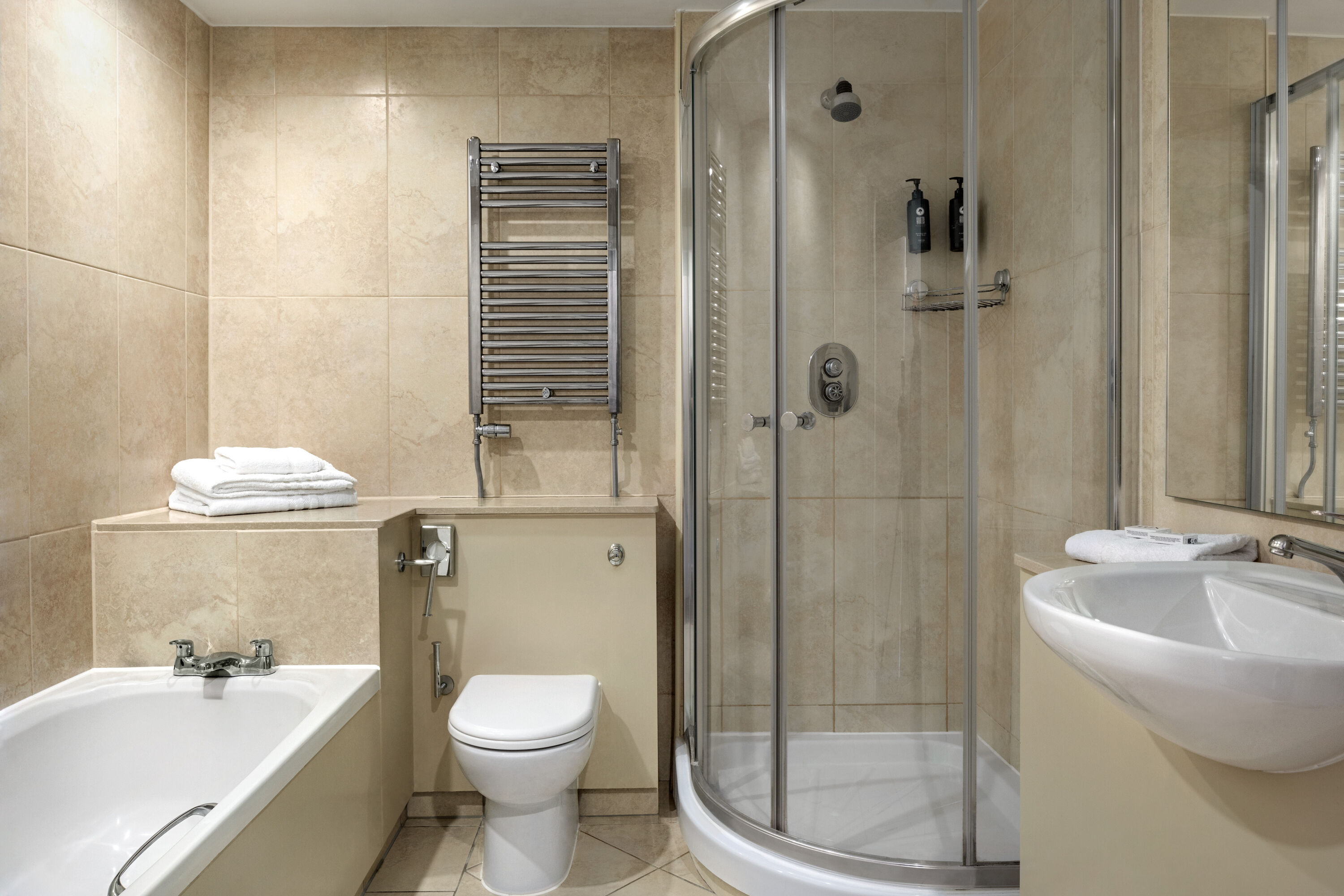 Guest room bath at the Ramada by Wyndham Cheltenham in Cheltenham, Other than US/Canada