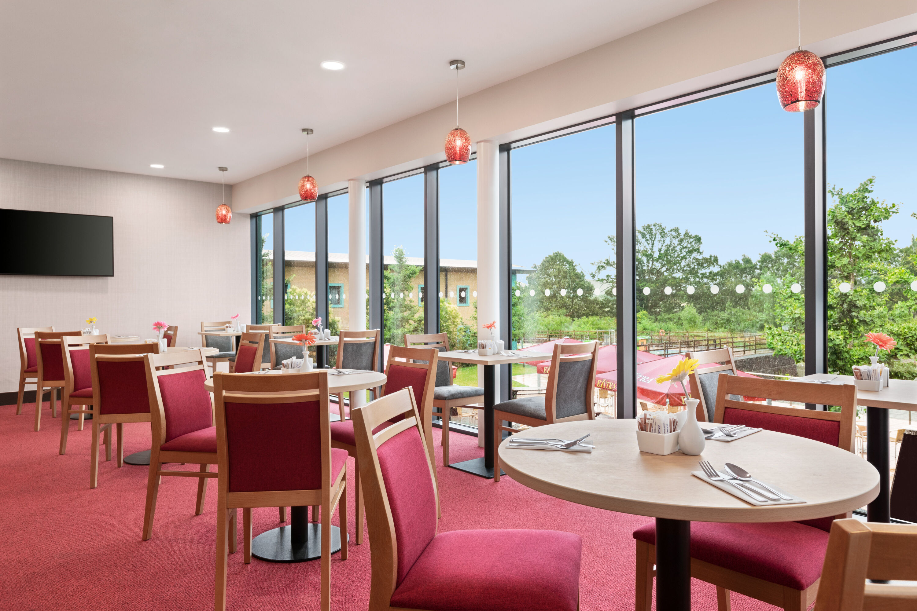 Ramada by Wyndham Cobham restaurant breakfast area with seating in Cobham, Other than US/Canada