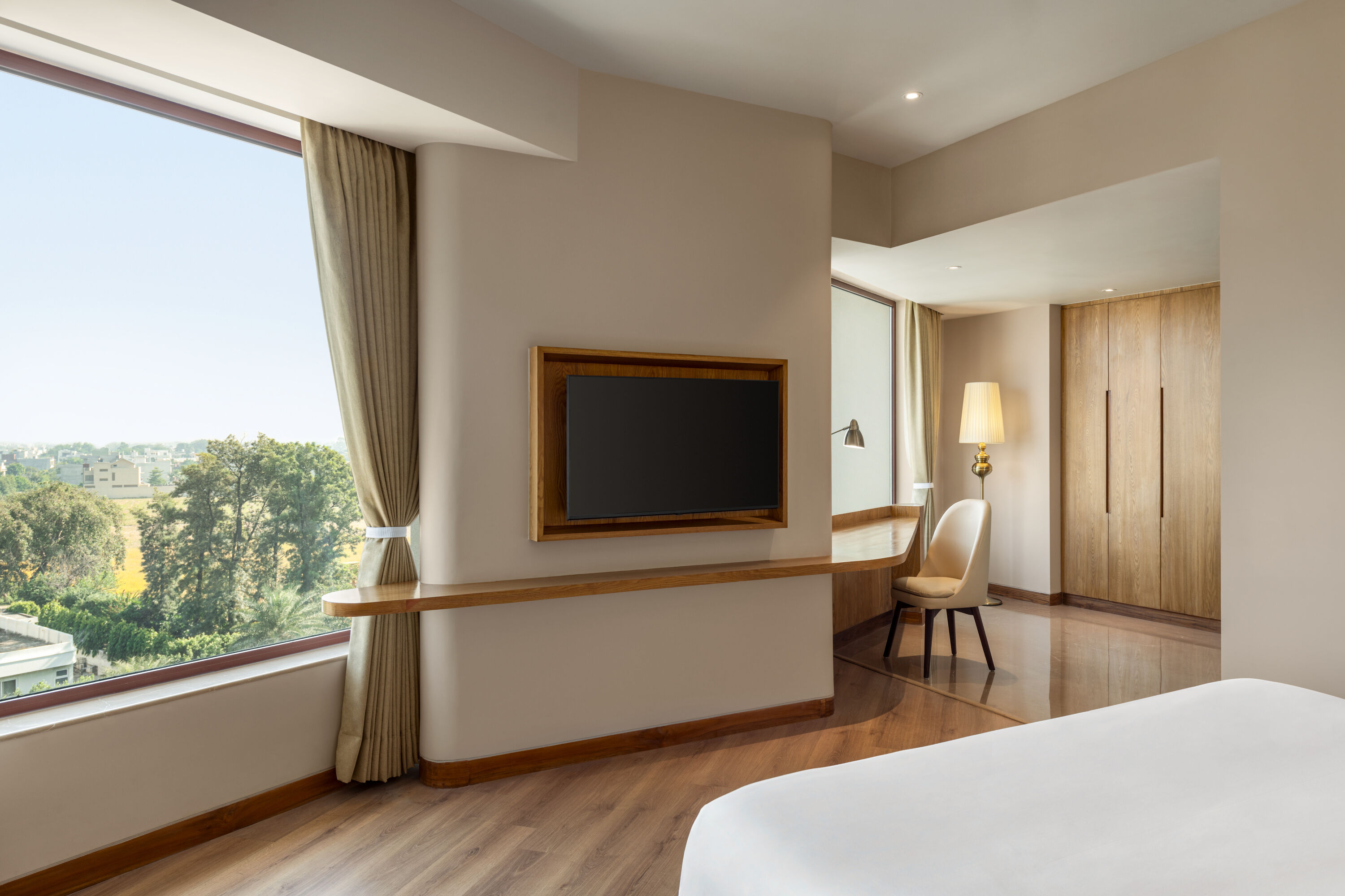 Guest room at the Ramada Encore by Wyndham Amritsar Airport in Amritsar, Other than US/Canada