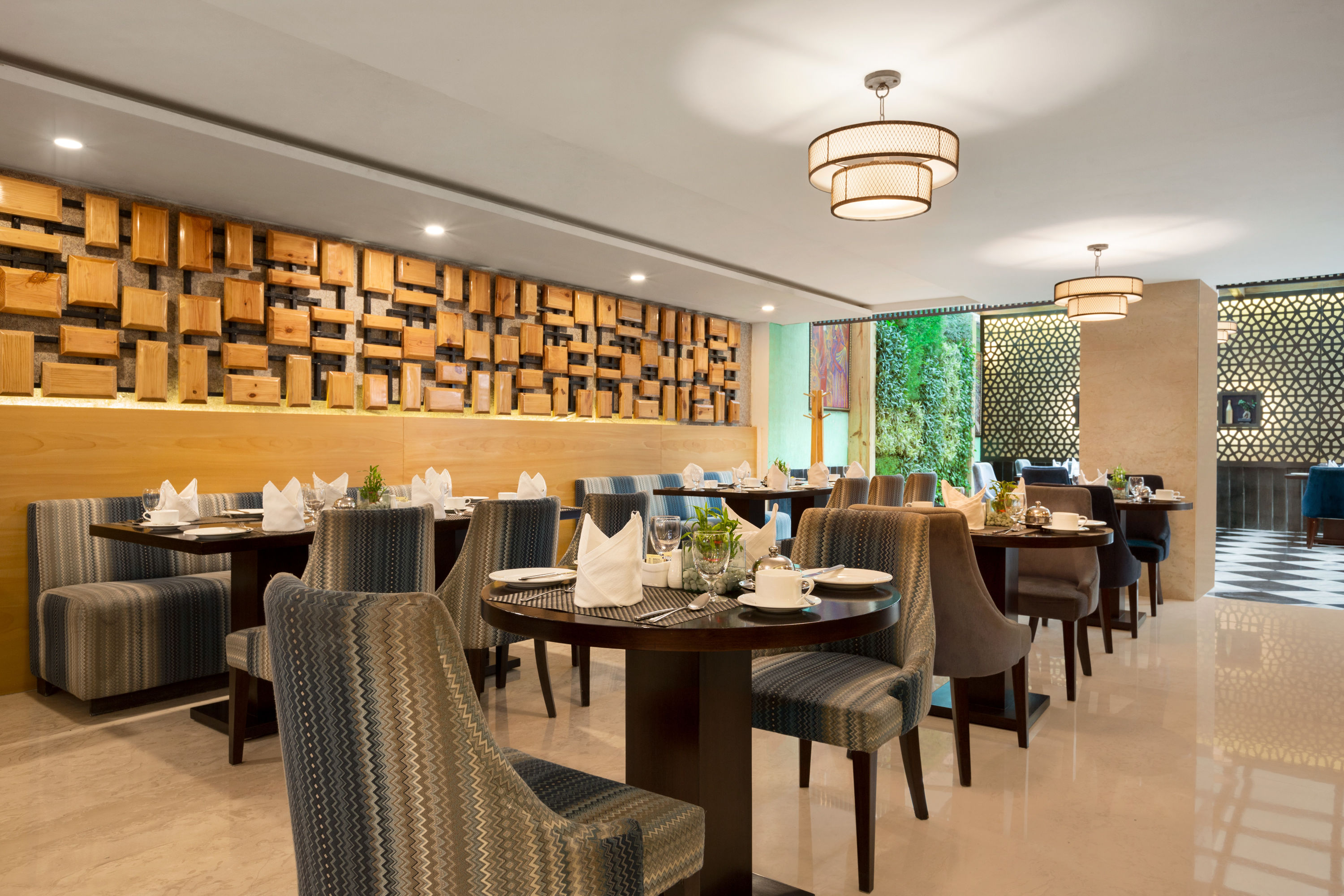 Ramada by Wyndham Dehradun Chakrata Road restaurant breakfast area with seating in Dehradun, Other than US/Canada