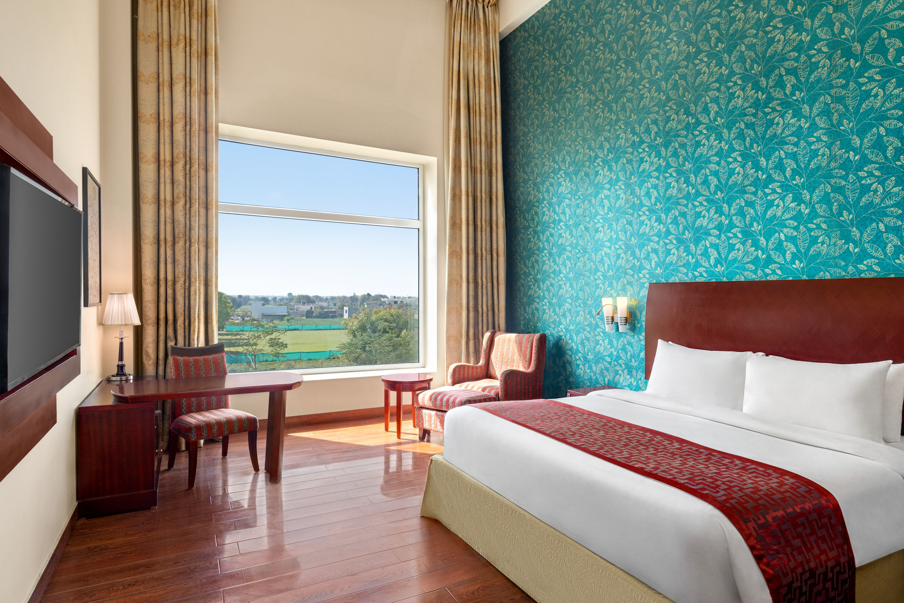 Guest room at the Ramada by Wyndham Jaipur Jaisinghpura in Jaipur, Other than US/Canada