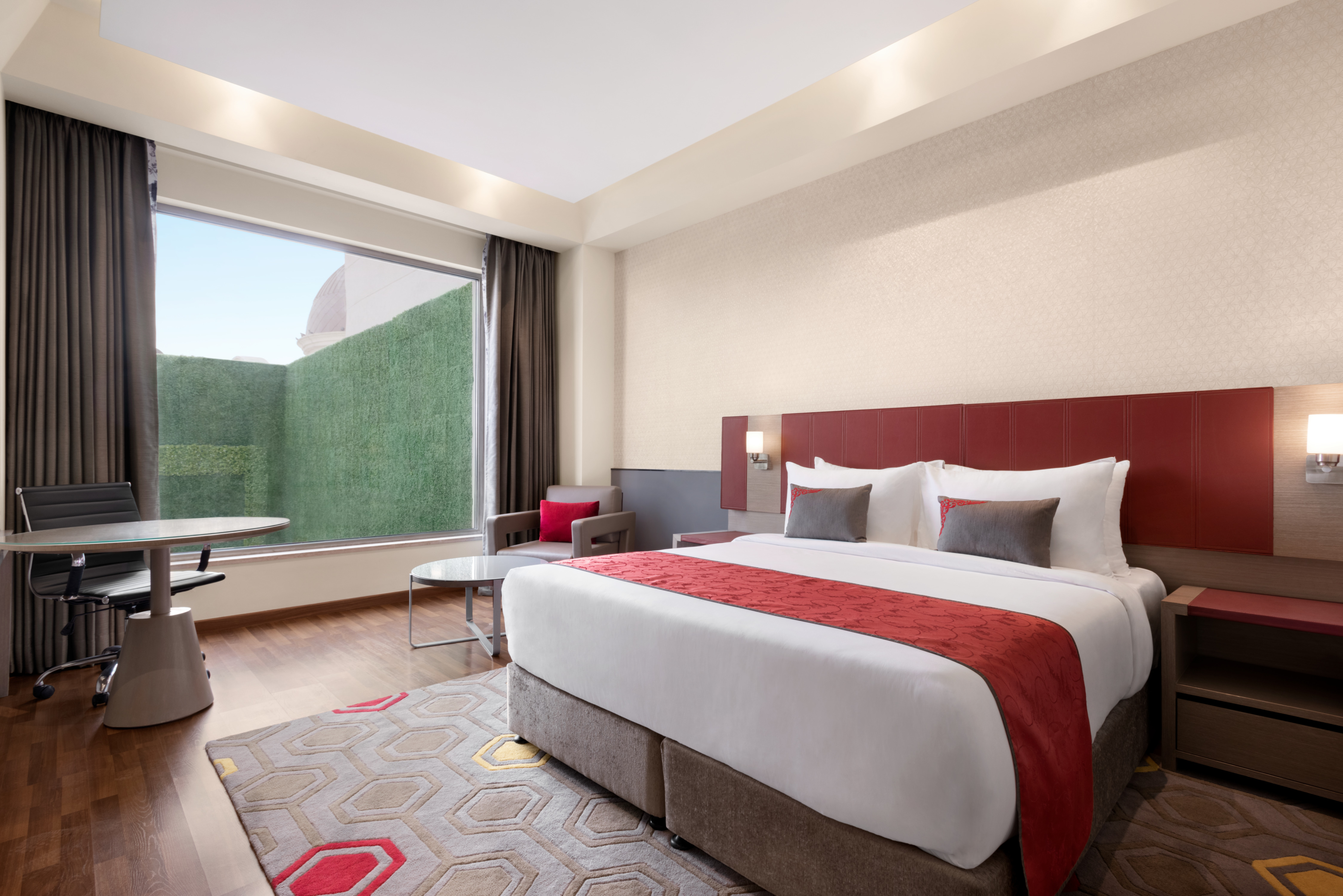Guest room at the Ramada Plaza by Wyndham Lucknow in Lucknow, Other than US/Canada