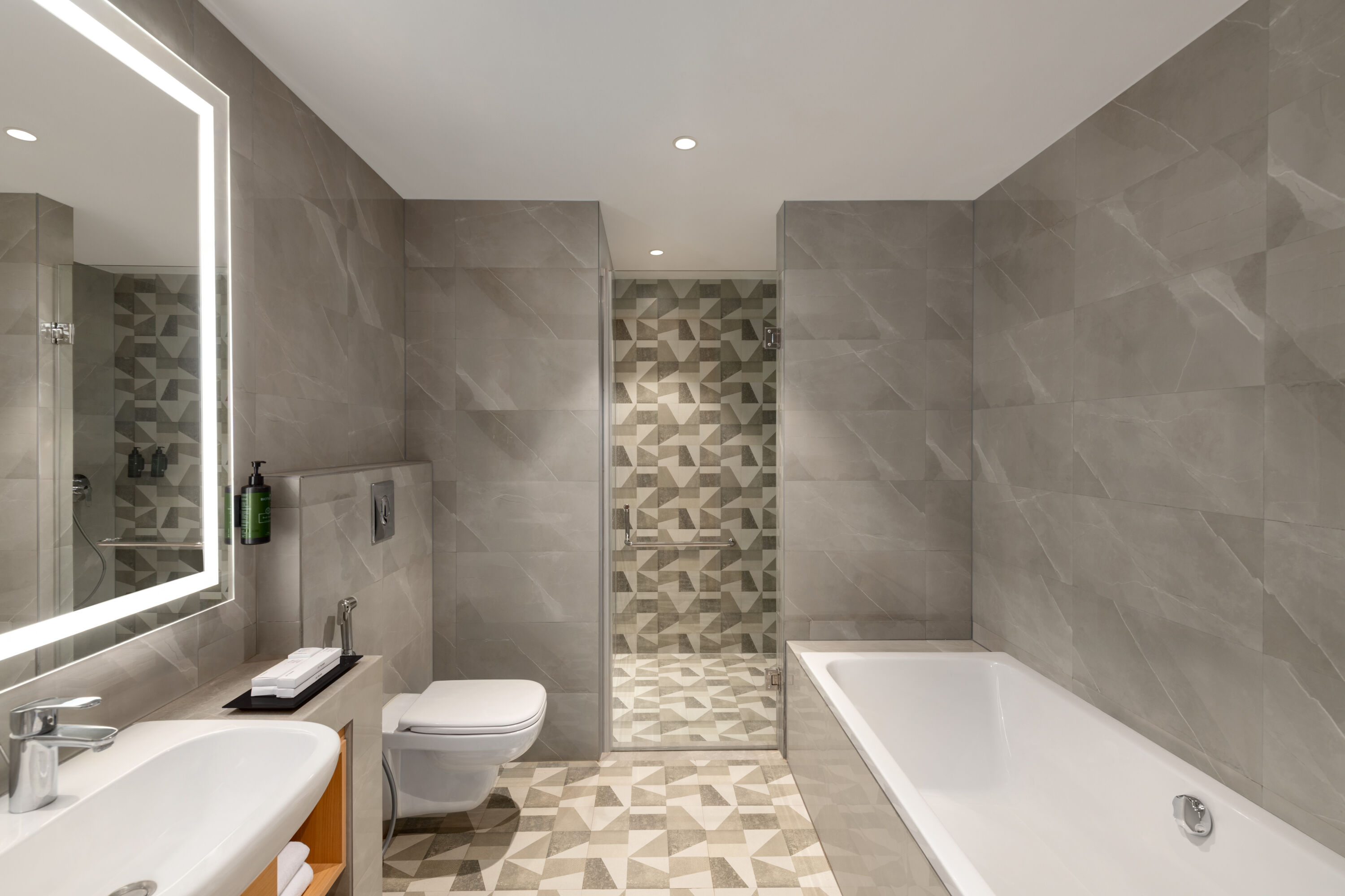 Guest room bath at the Ramada Encore by Wyndham Lucknow Airport in Lucknow, Other than US/Canada