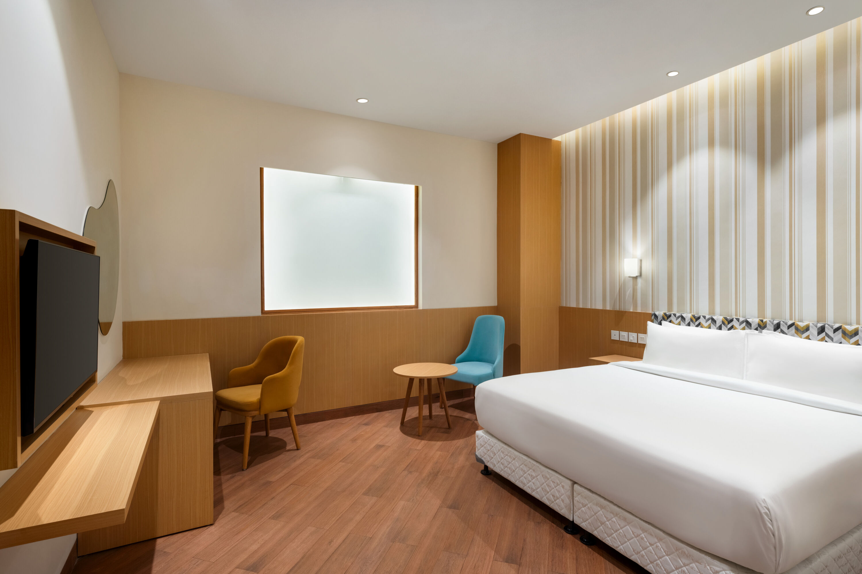 Guest room at the Ramada Encore by Wyndham Lucknow Airport in Lucknow, Other than US/Canada