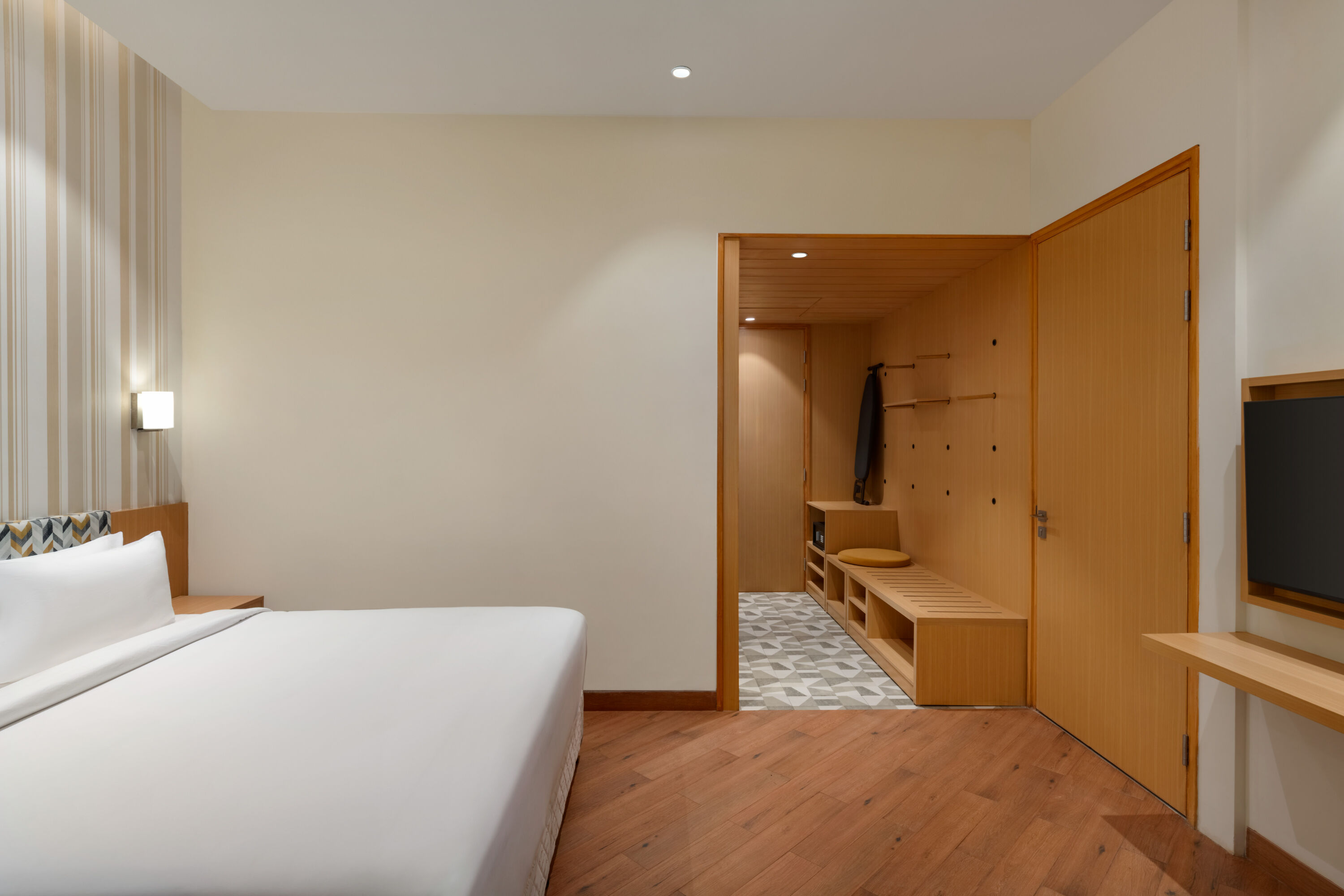 Guest room at the Ramada Encore by Wyndham Lucknow Airport in Lucknow, Other than US/Canada