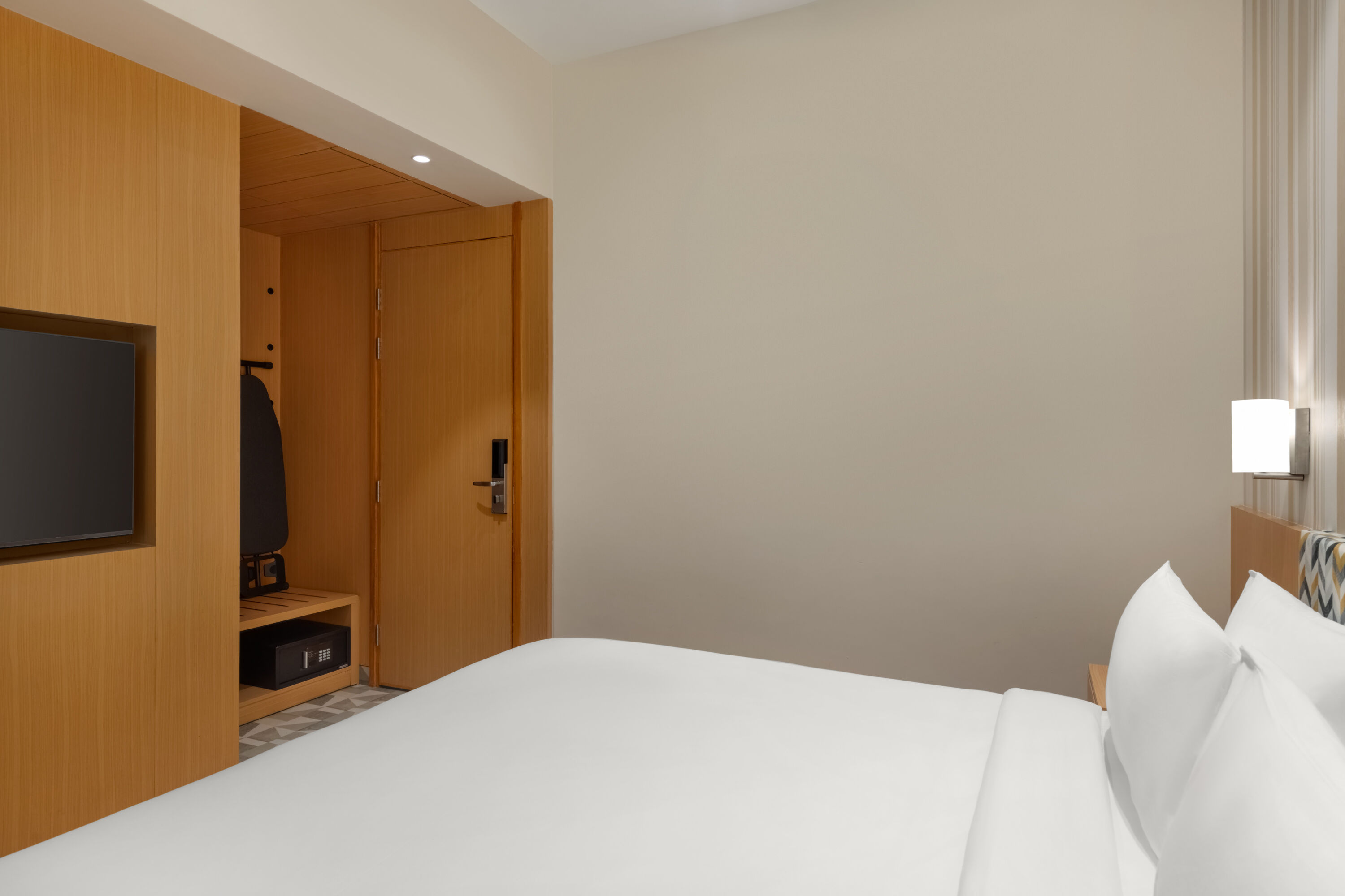 Guest room at the Ramada Encore by Wyndham Lucknow Airport in Lucknow, Other than US/Canada