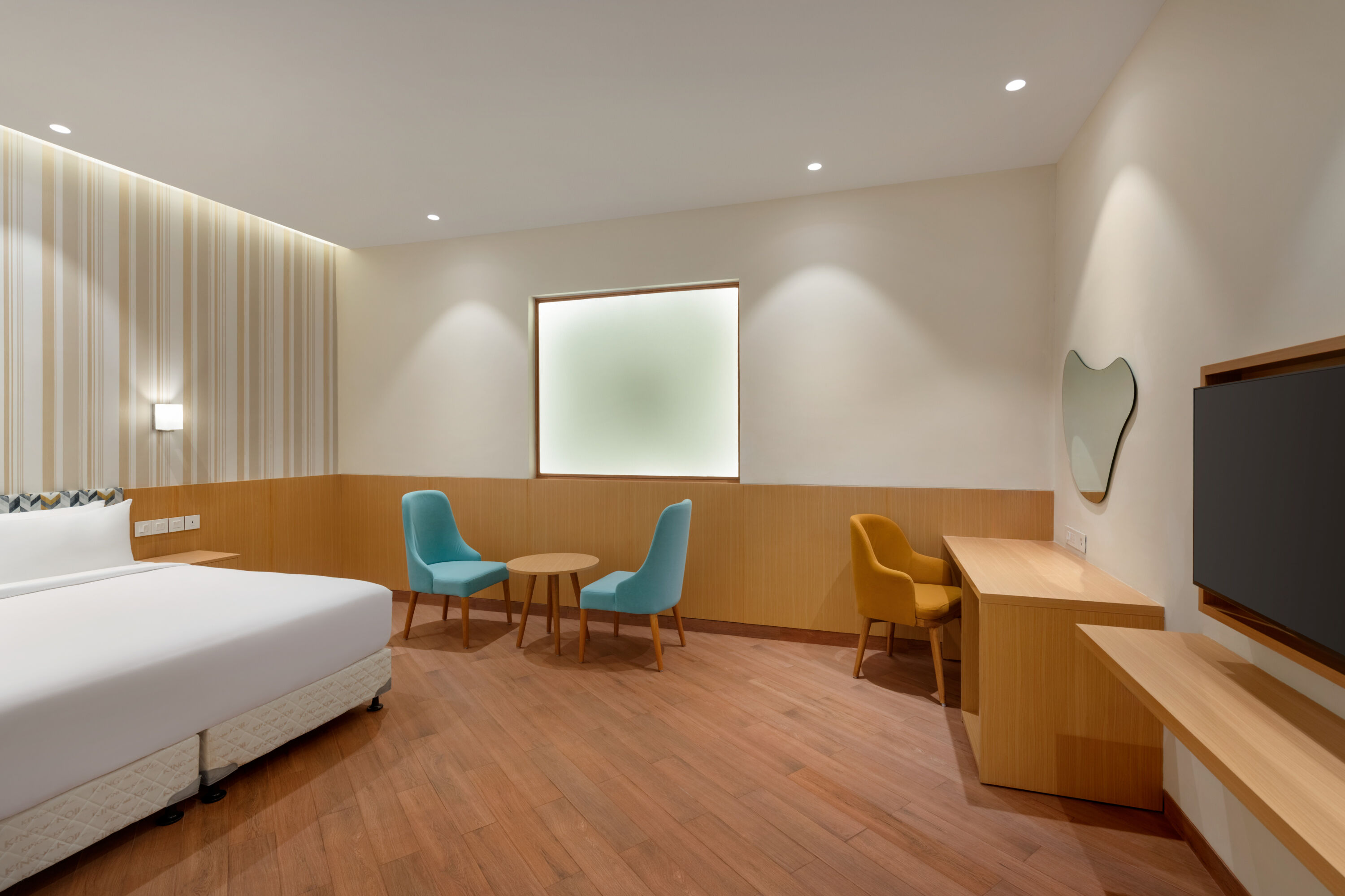 Guest room at the Ramada Encore by Wyndham Lucknow Airport in Lucknow, Other than US/Canada