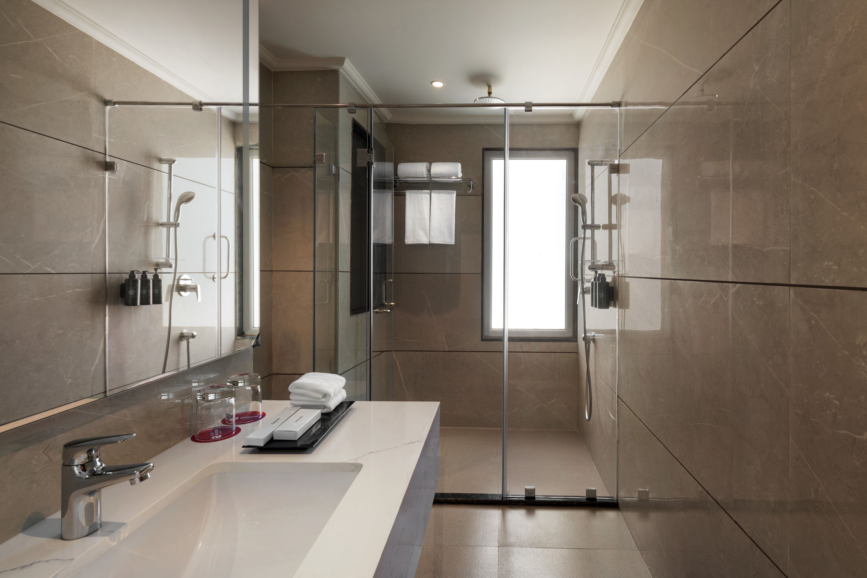 Guest room bath at the Ramada Encore by Wyndham Udaipur Roopnagar in Udaipur, Other than US/Canada