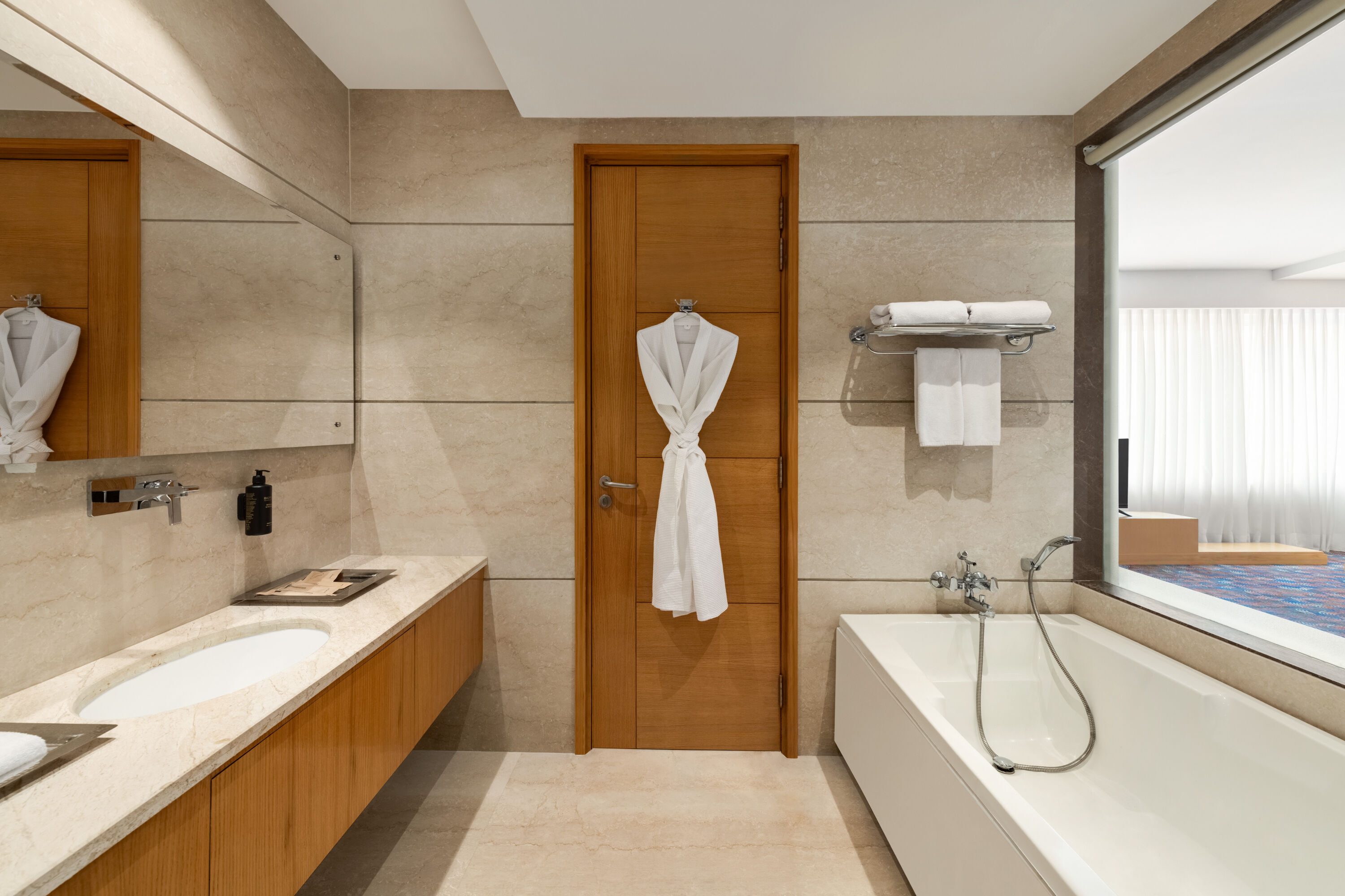 Guest room bath at the Ramada Plaza by Wyndham Jammu Vijaypur in Vijaypur, Other than US/Canada