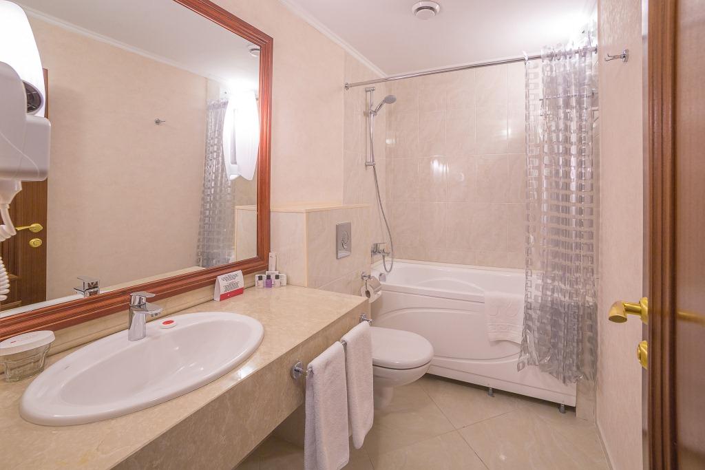 Guest room bath at the Ramada by Wyndham Almaty in Almaty, Other than US/Canada