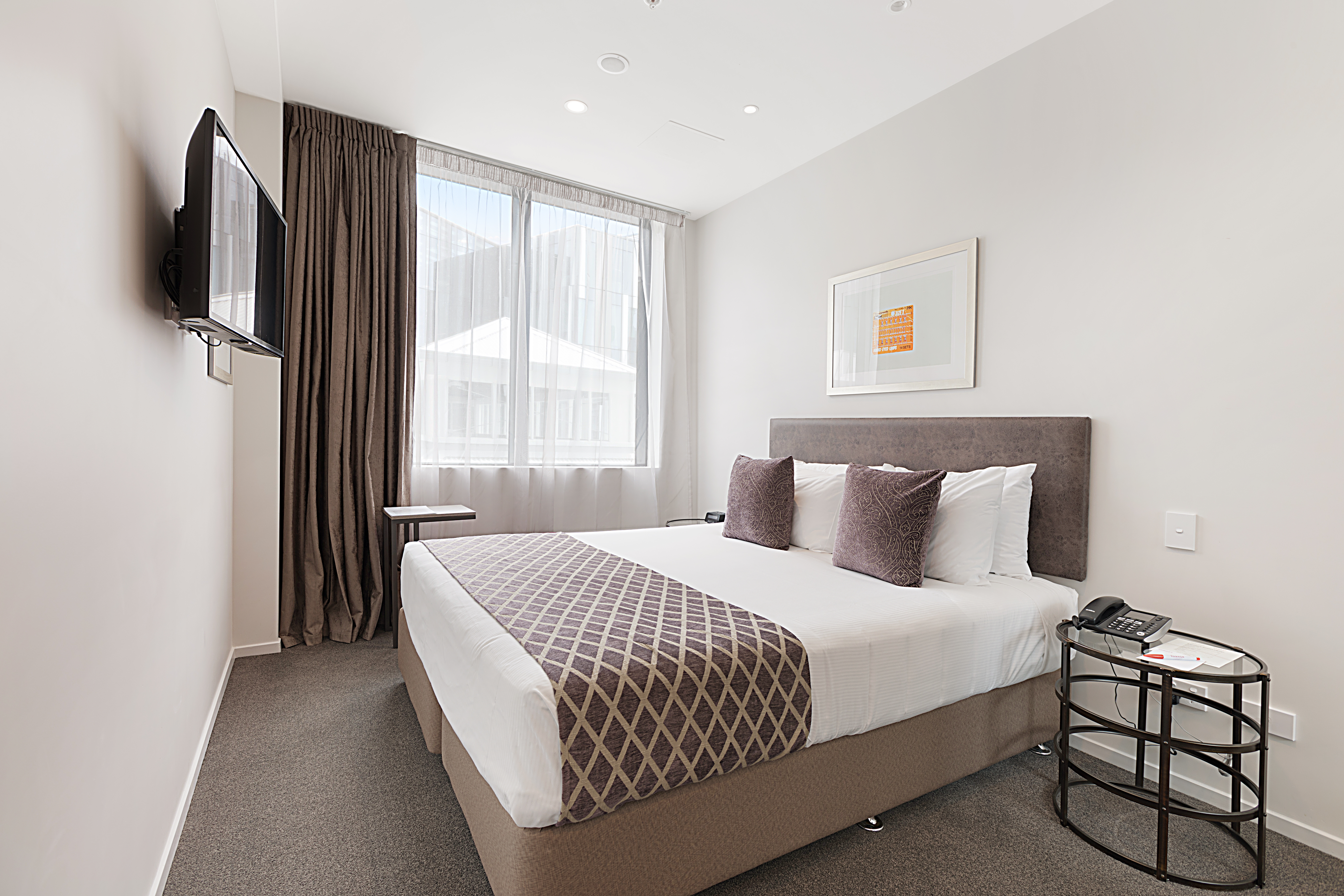 Guest room at the Ramada Suites By Wyndham Victoria Street West in Auckland, Other than US/Canada