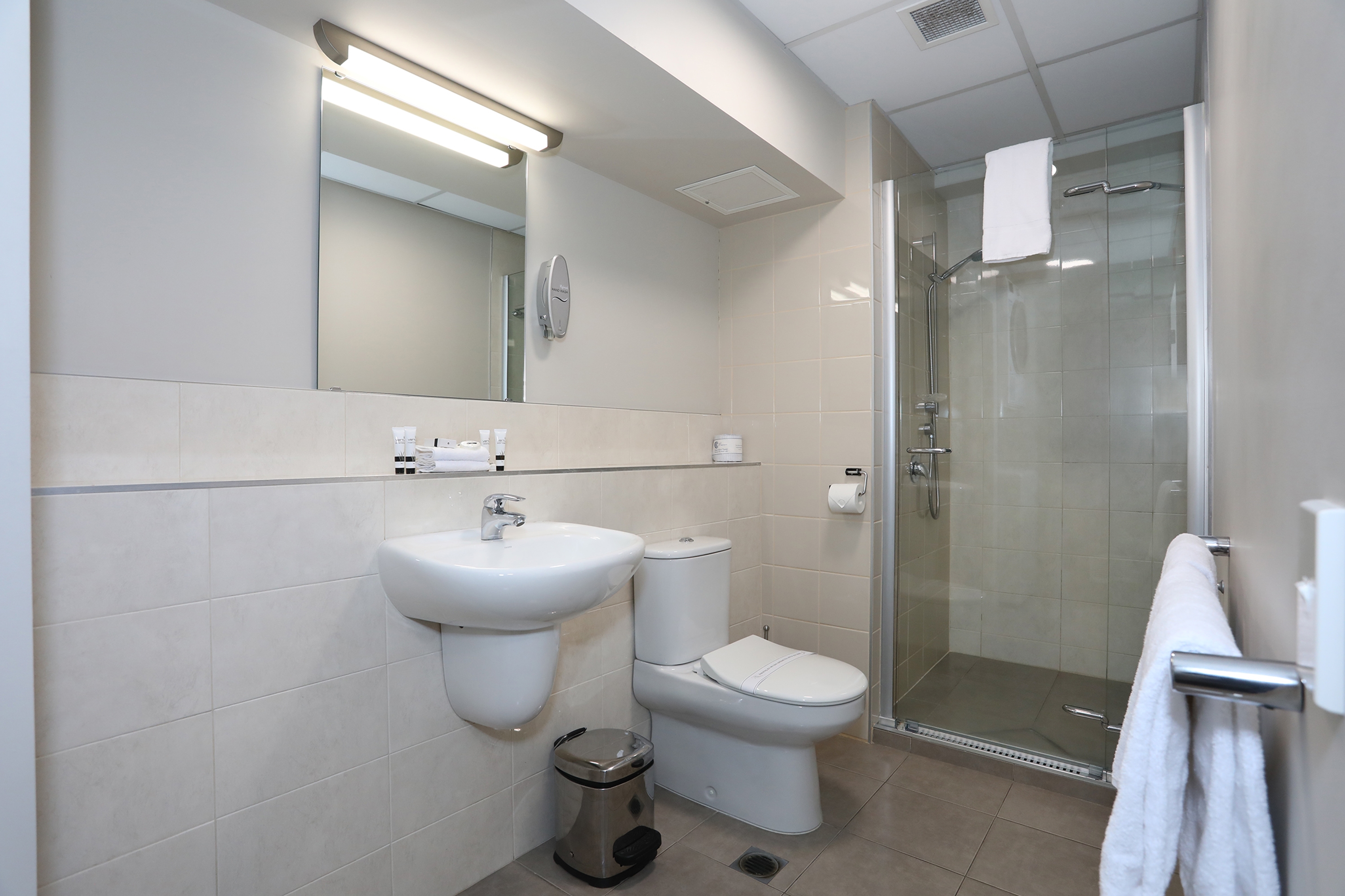 Guest room bath at the Ramada Encore by Wyndham Palmerston North in Palmerston North Central, Other than US/Canada
