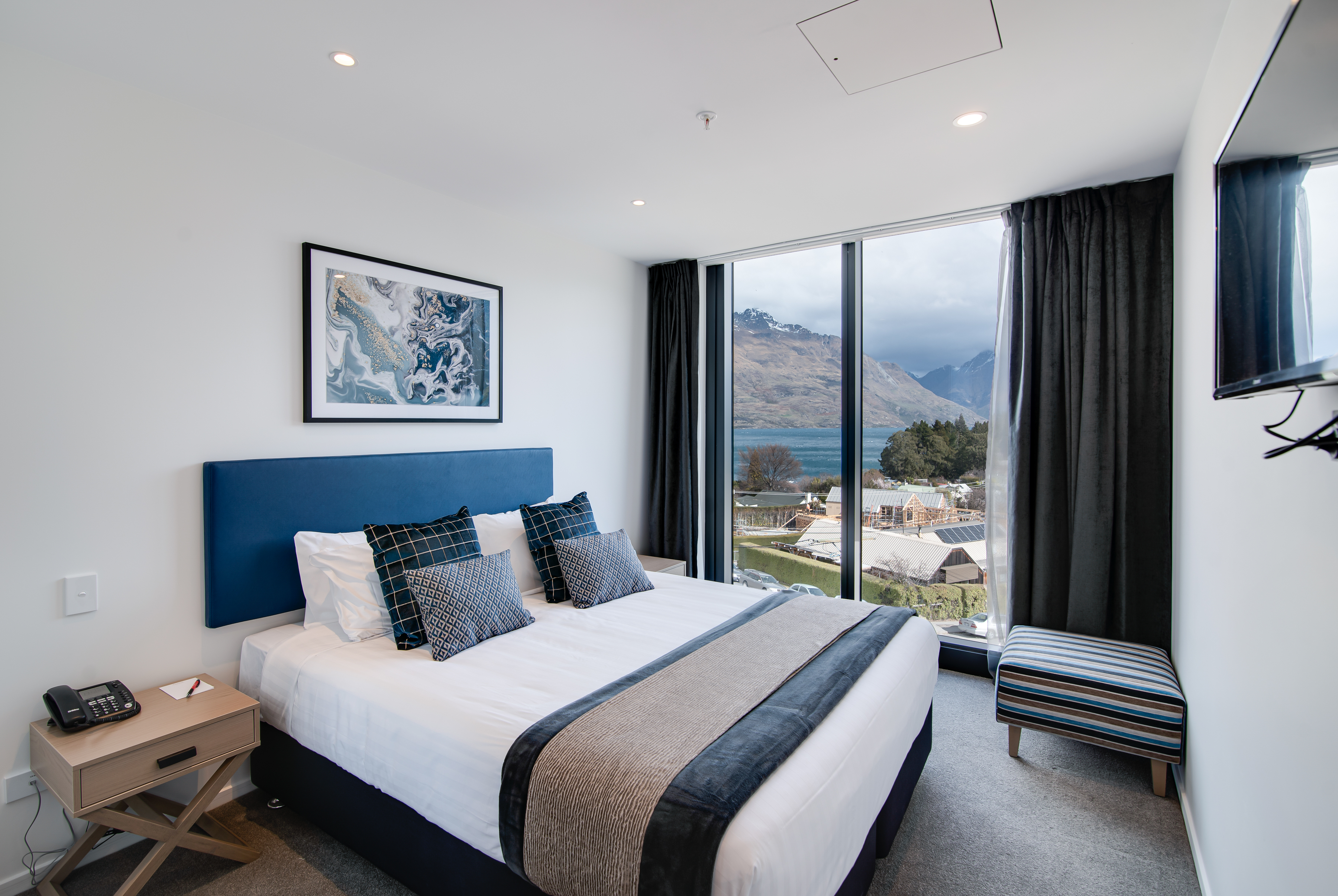 Guest room at the Ramada By Wyndham Queenstown Central in Queenstown, Other than US/Canada
