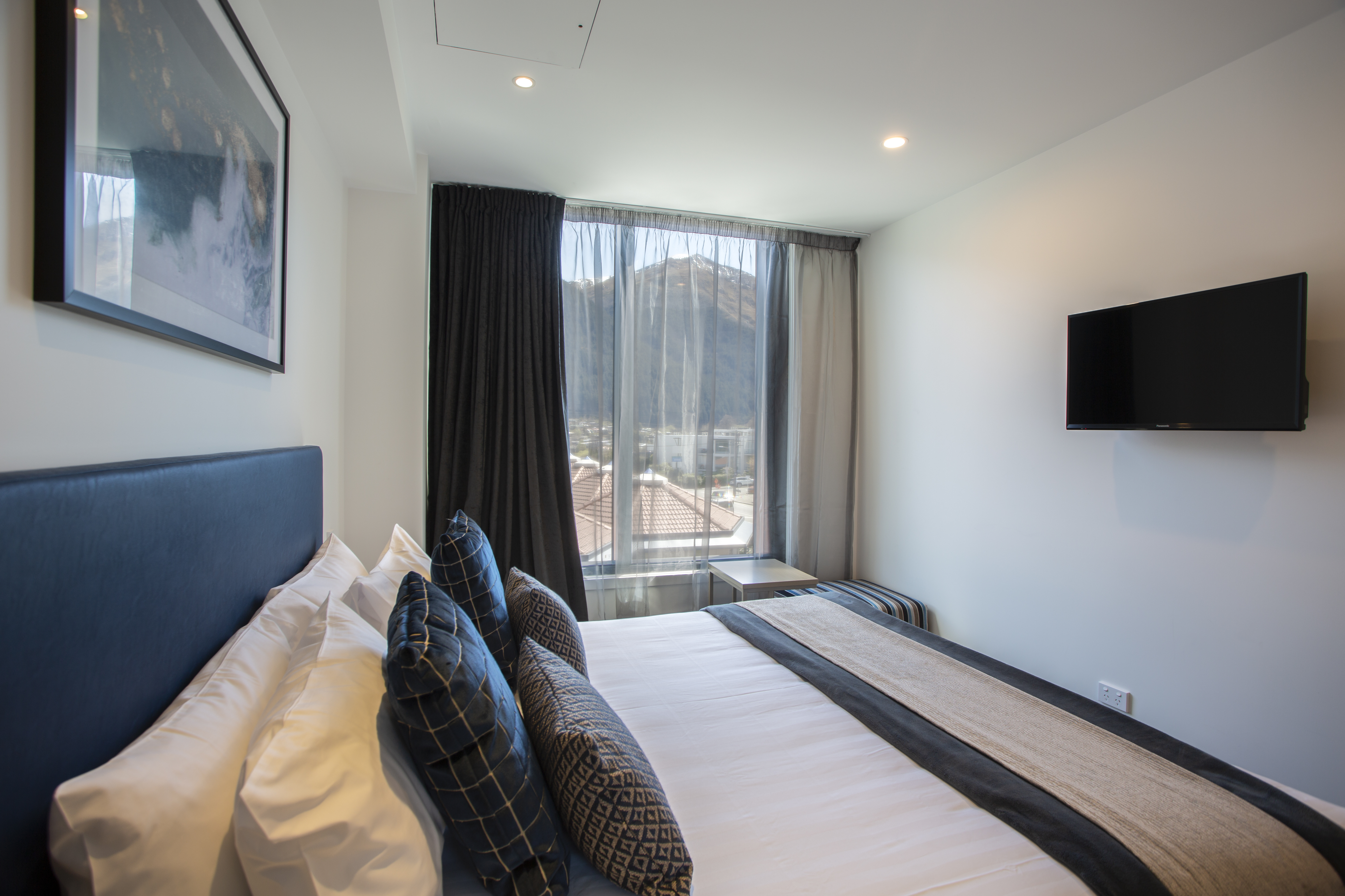 Guest room at the Ramada By Wyndham Queenstown Central in Queenstown, Other than US/Canada