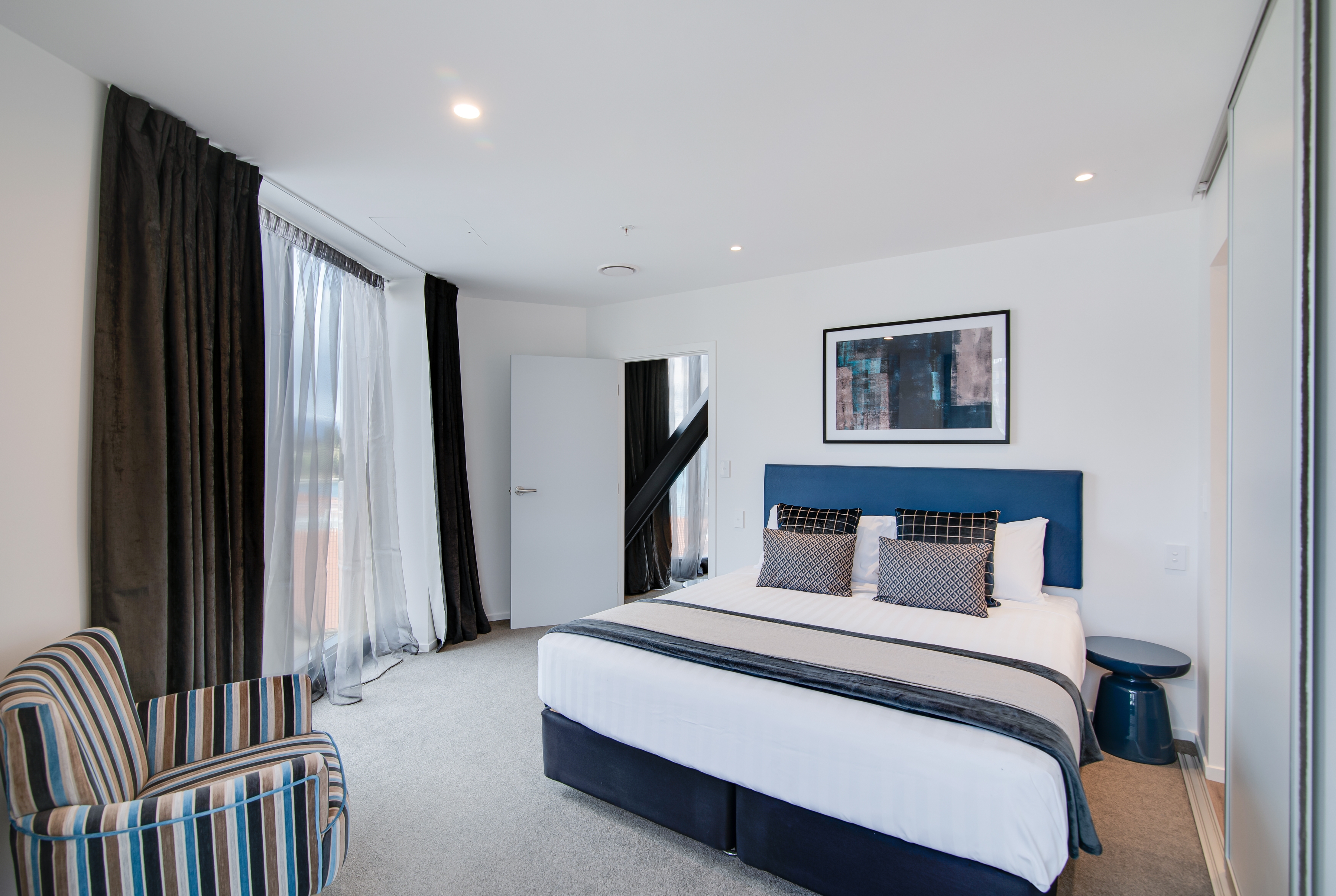 Guest room at the Ramada By Wyndham Queenstown Central in Queenstown, Other than US/Canada