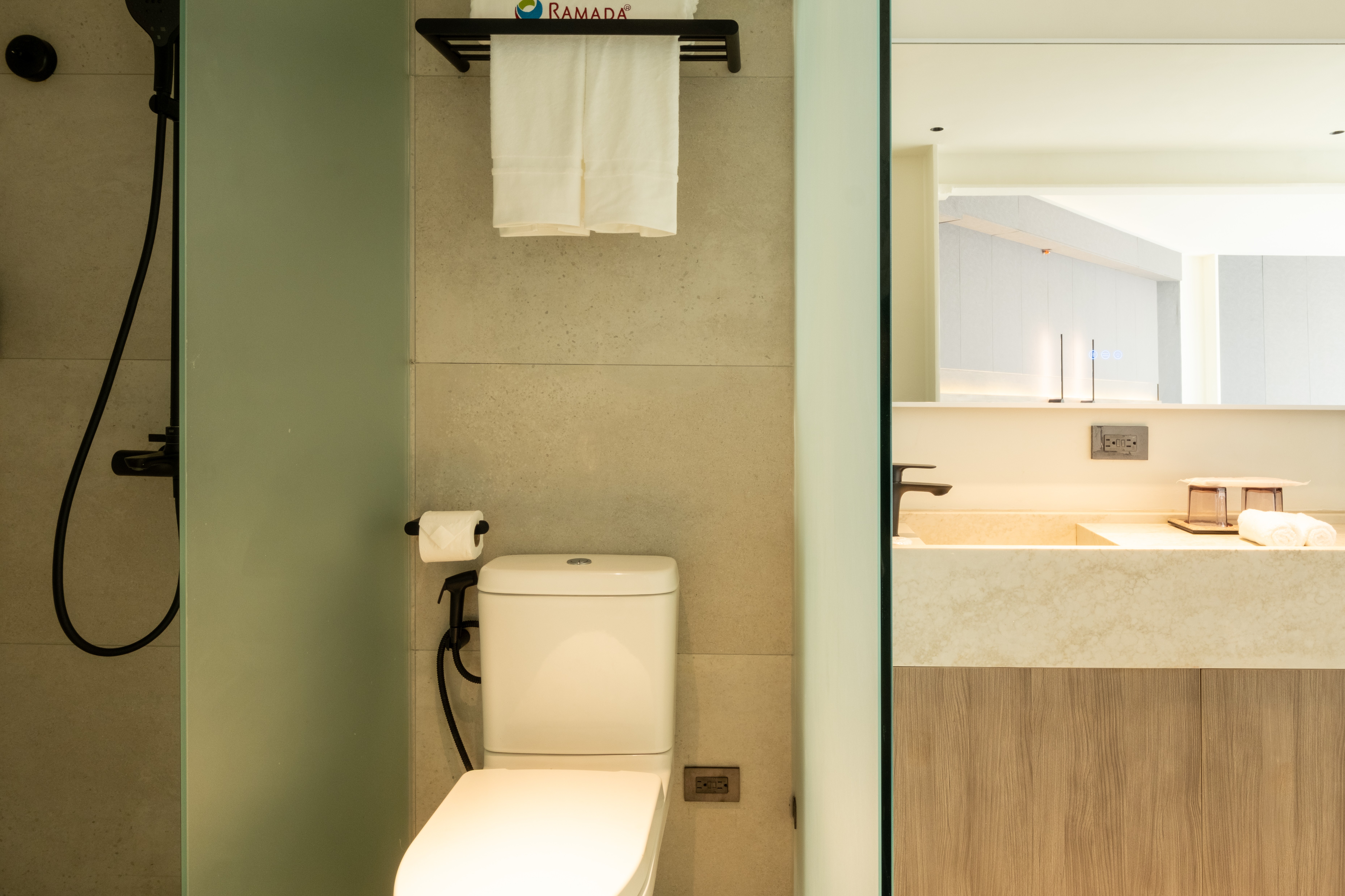 Guest room bath at the Ramada Encore by Wyndham Boracay White Beach in Malay, Other than US/Canada