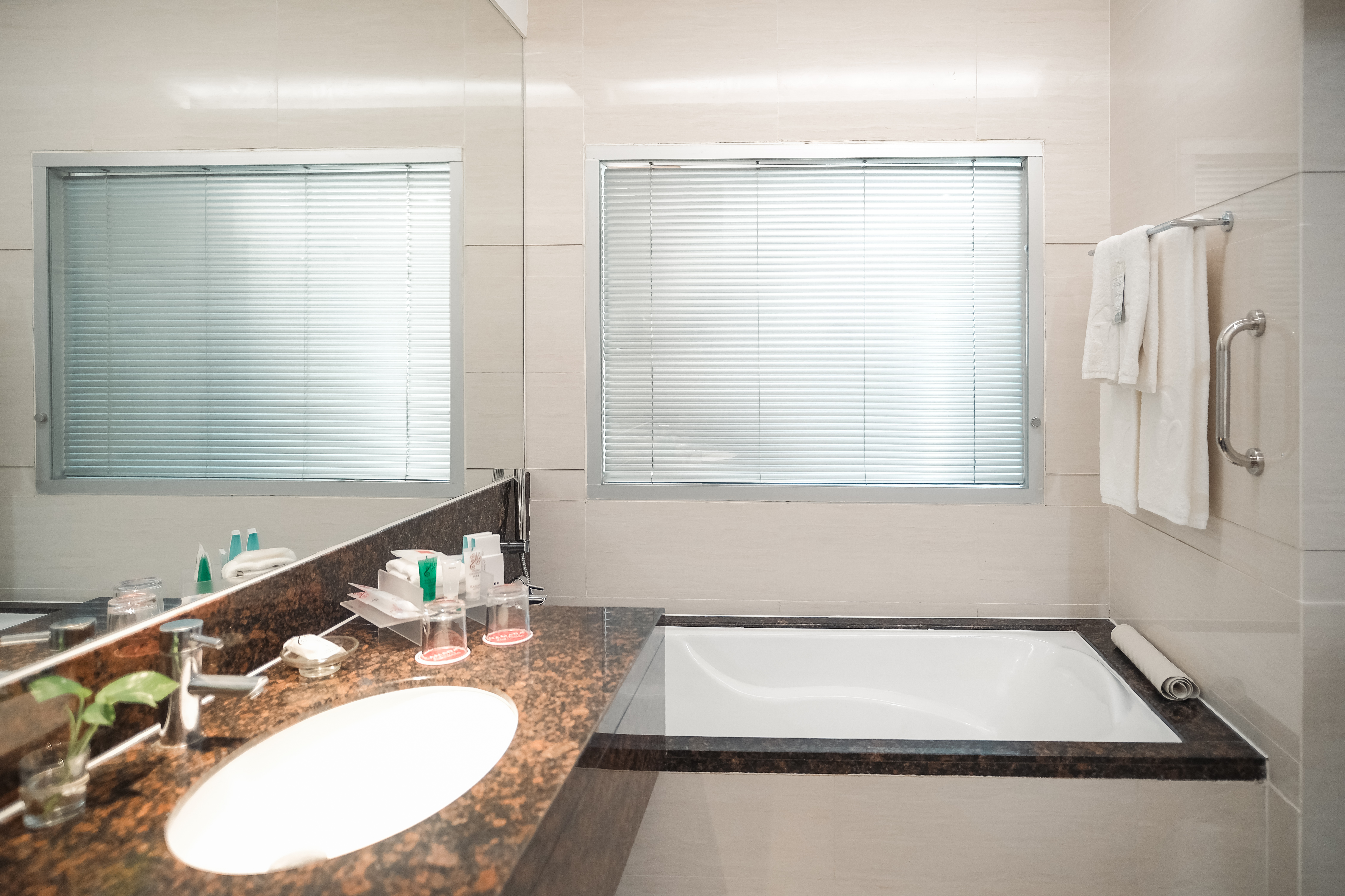 Guest room bath at the Ramada by Wyndham Manila Central in Manila, Other than US/Canada