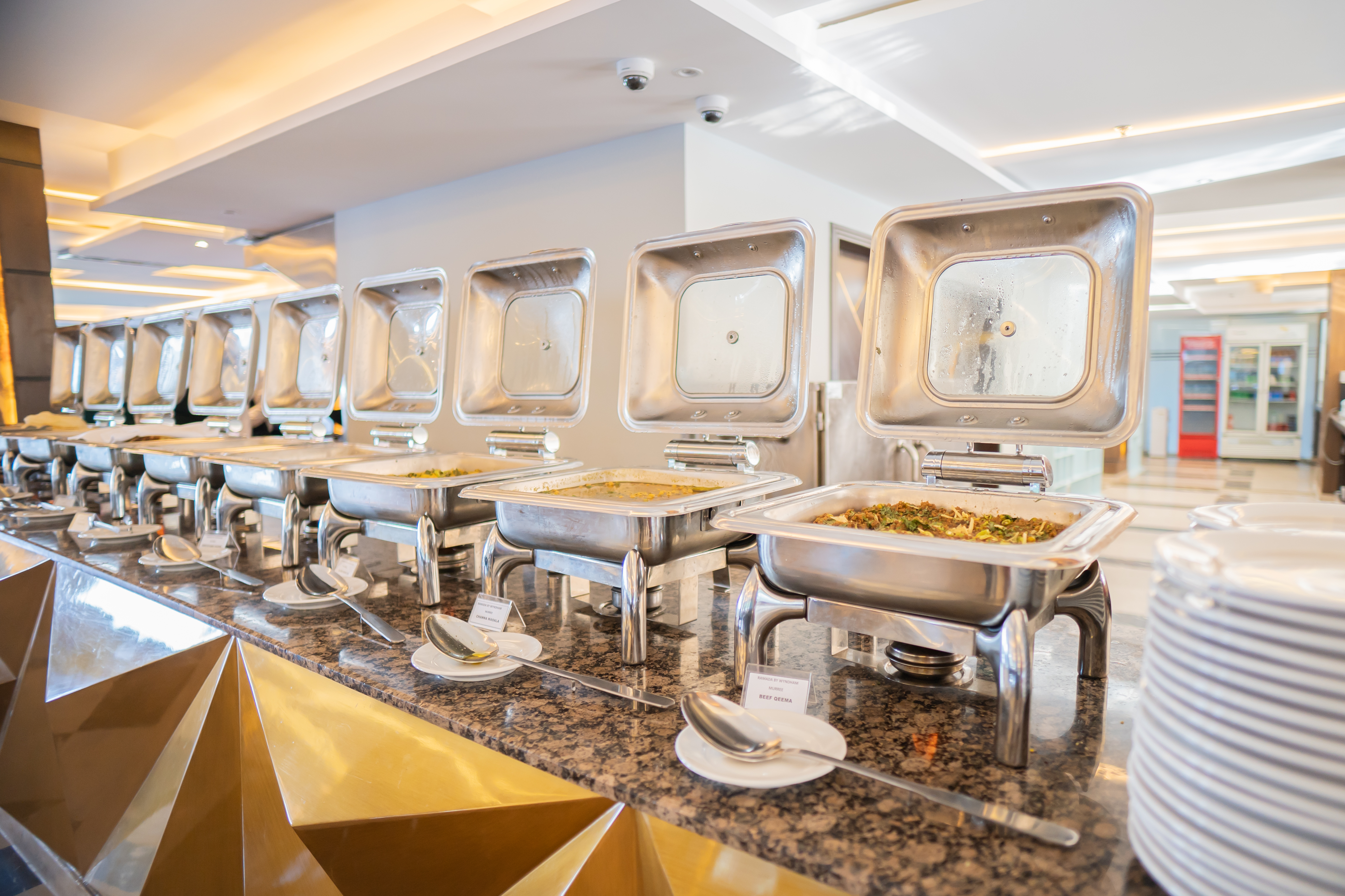 Ramada by Wyndham Murree Lower Topa Resort restaurant breakfast area with seating in Lower Topa, Murree, Other than US/Canada