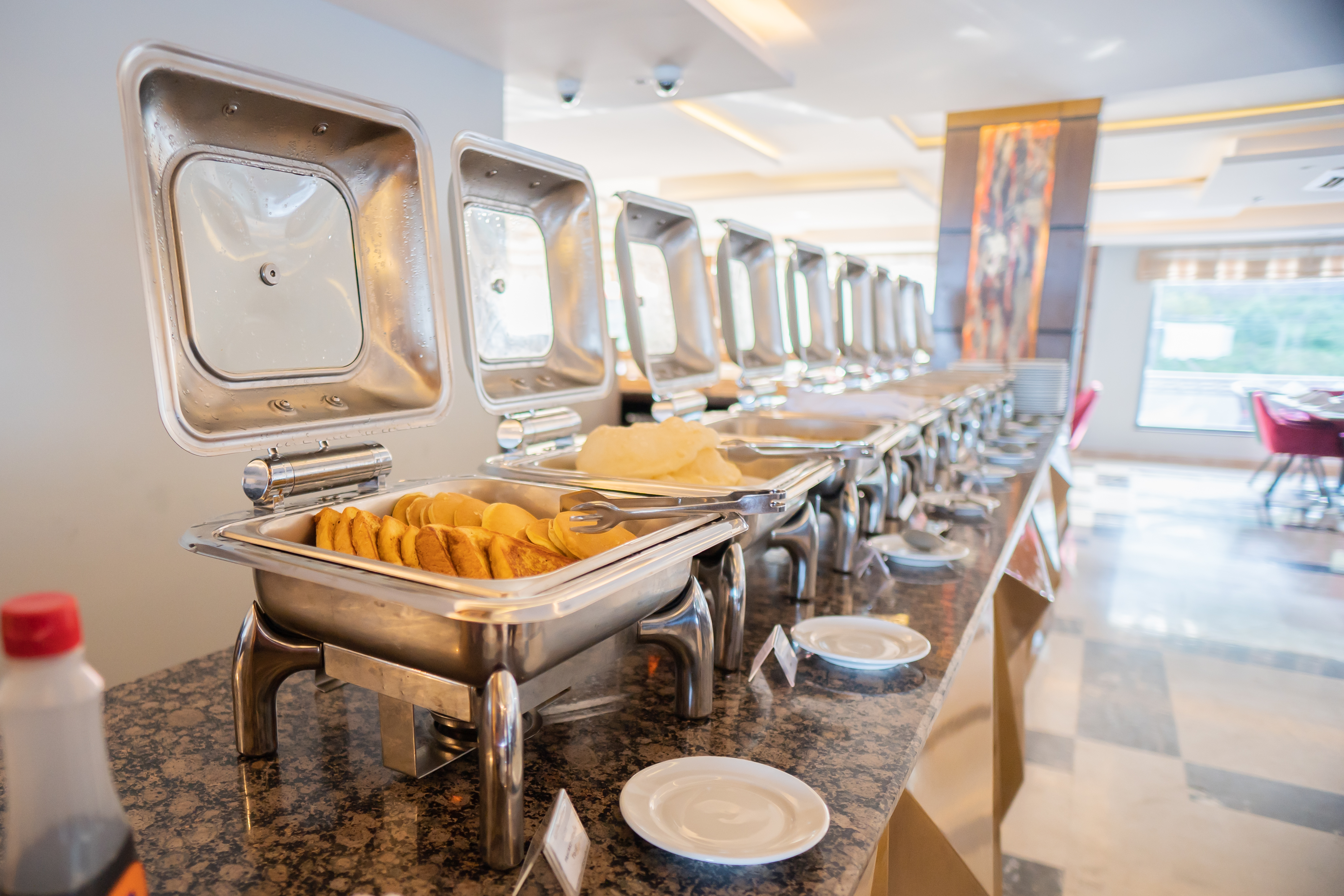 Ramada by Wyndham Murree Lower Topa Resort restaurant breakfast area with seating in Lower Topa, Murree, Other than US/Canada