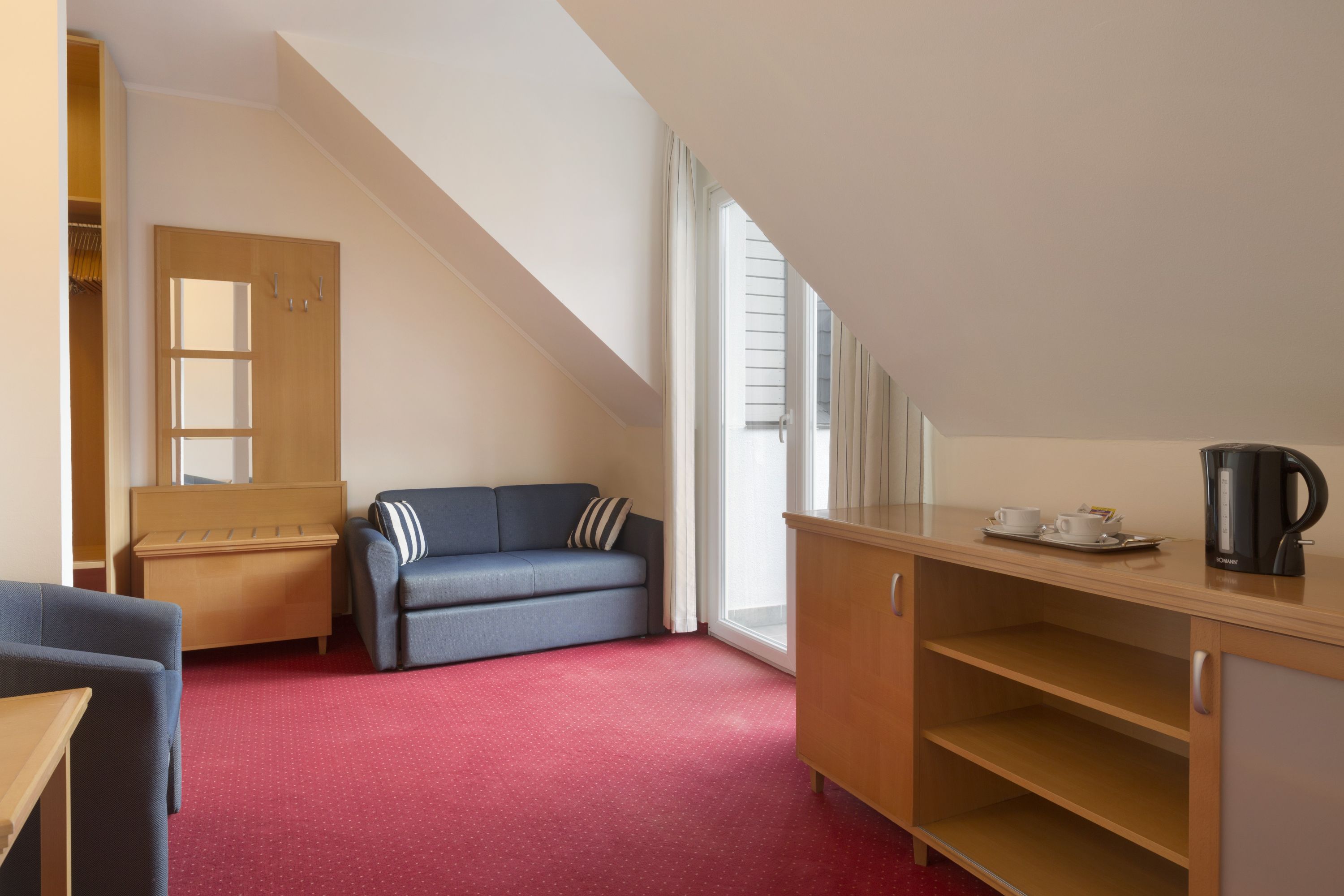 Guest room at the Ramada Hotel & Suites by Wyndham Kranjska Gora in Kranjska Gora, Other than US/Canada