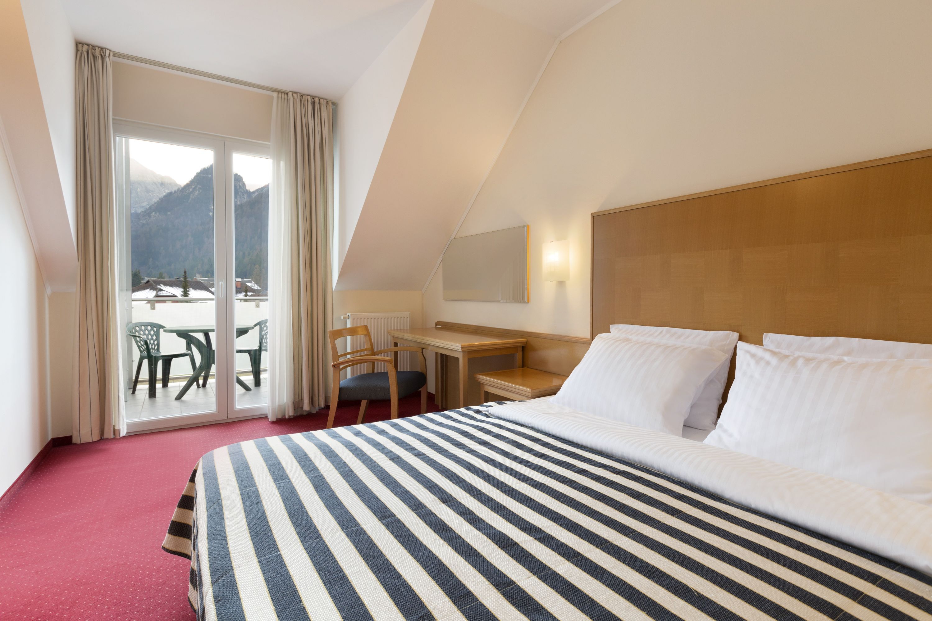 Guest room at the Ramada Hotel & Suites by Wyndham Kranjska Gora in Kranjska Gora, Other than US/Canada