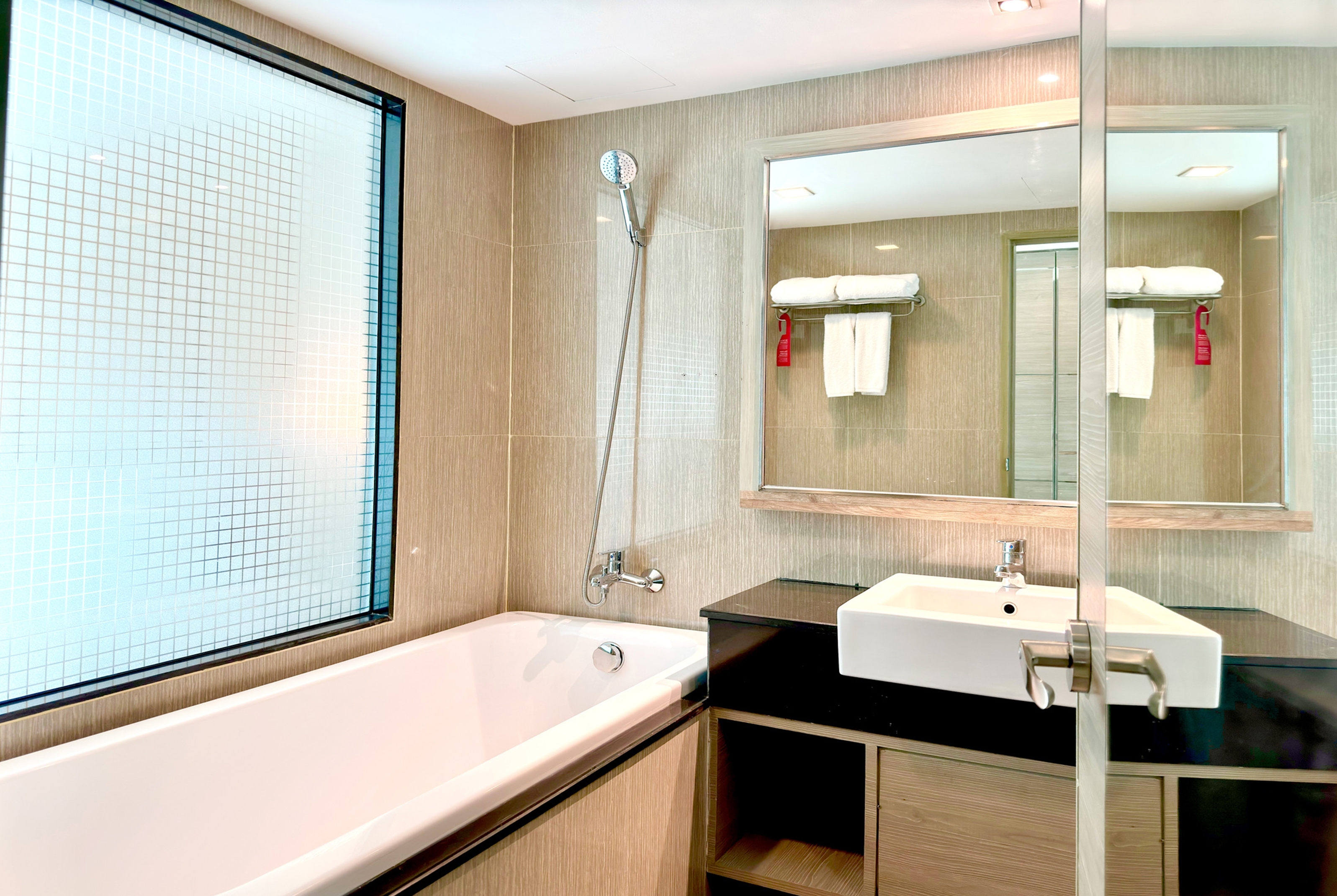 Guest room bath at the Ramada by Wyndham Bangkok Sukhumvit 11 in Bangkok, Other than US/Canada