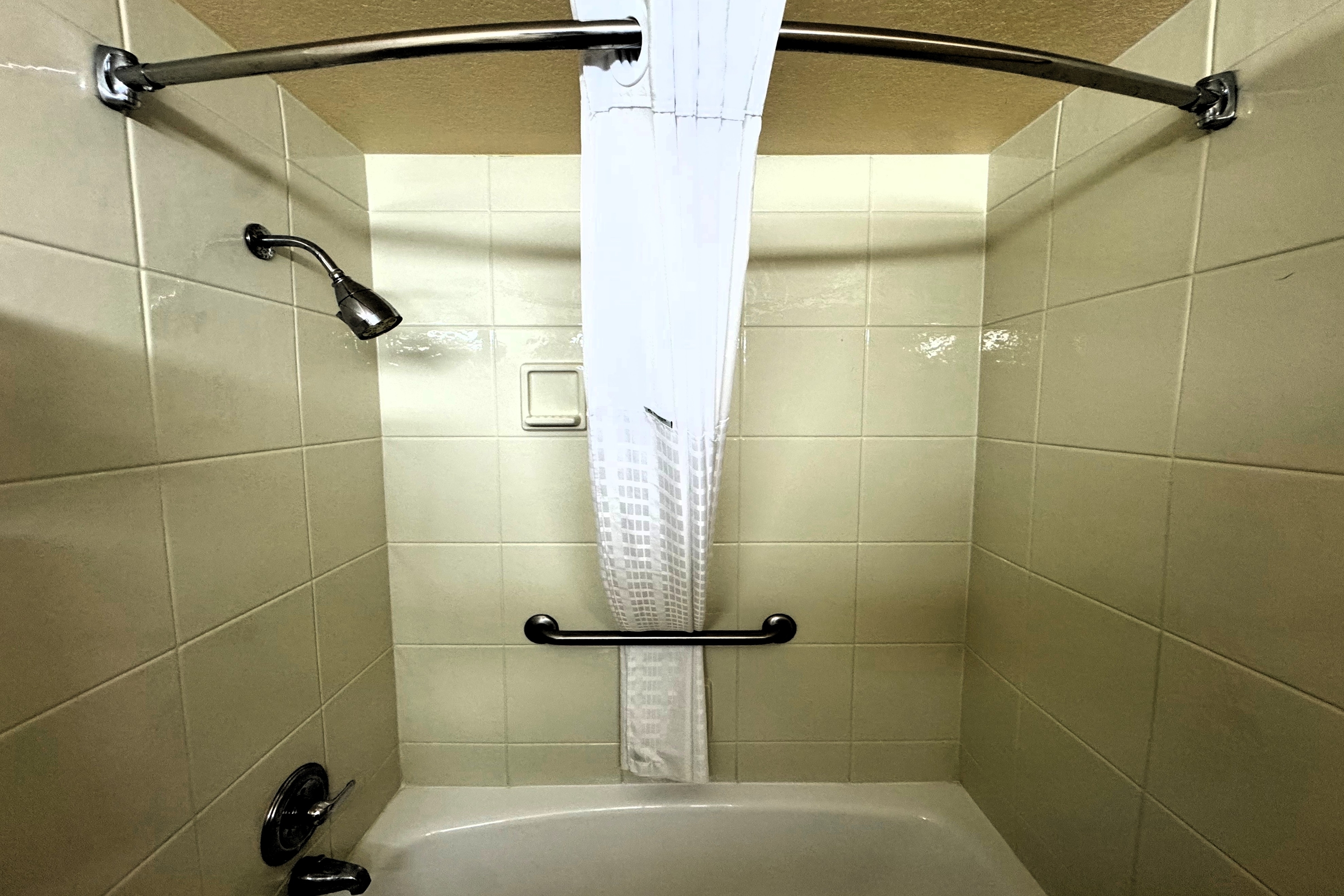 Guest room bath at the Ramada by Wyndham Birmingham Airport in Birmingham, Alabama
