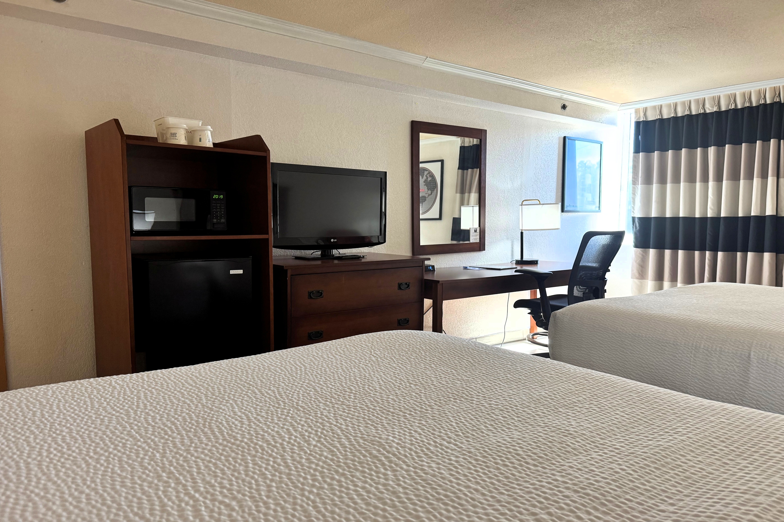 Guest room at the Ramada by Wyndham Birmingham Airport in Birmingham, Alabama