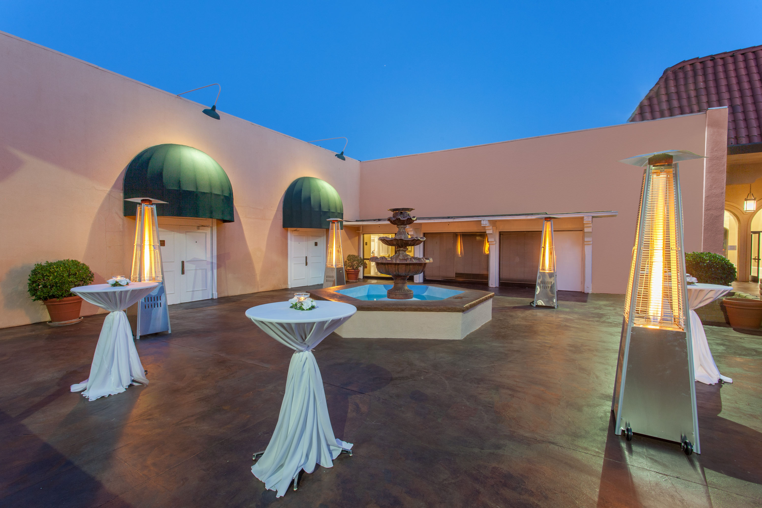 Exterior Dusk Image of Ramada by Wyndham Fresno North hotel in Fresno, California