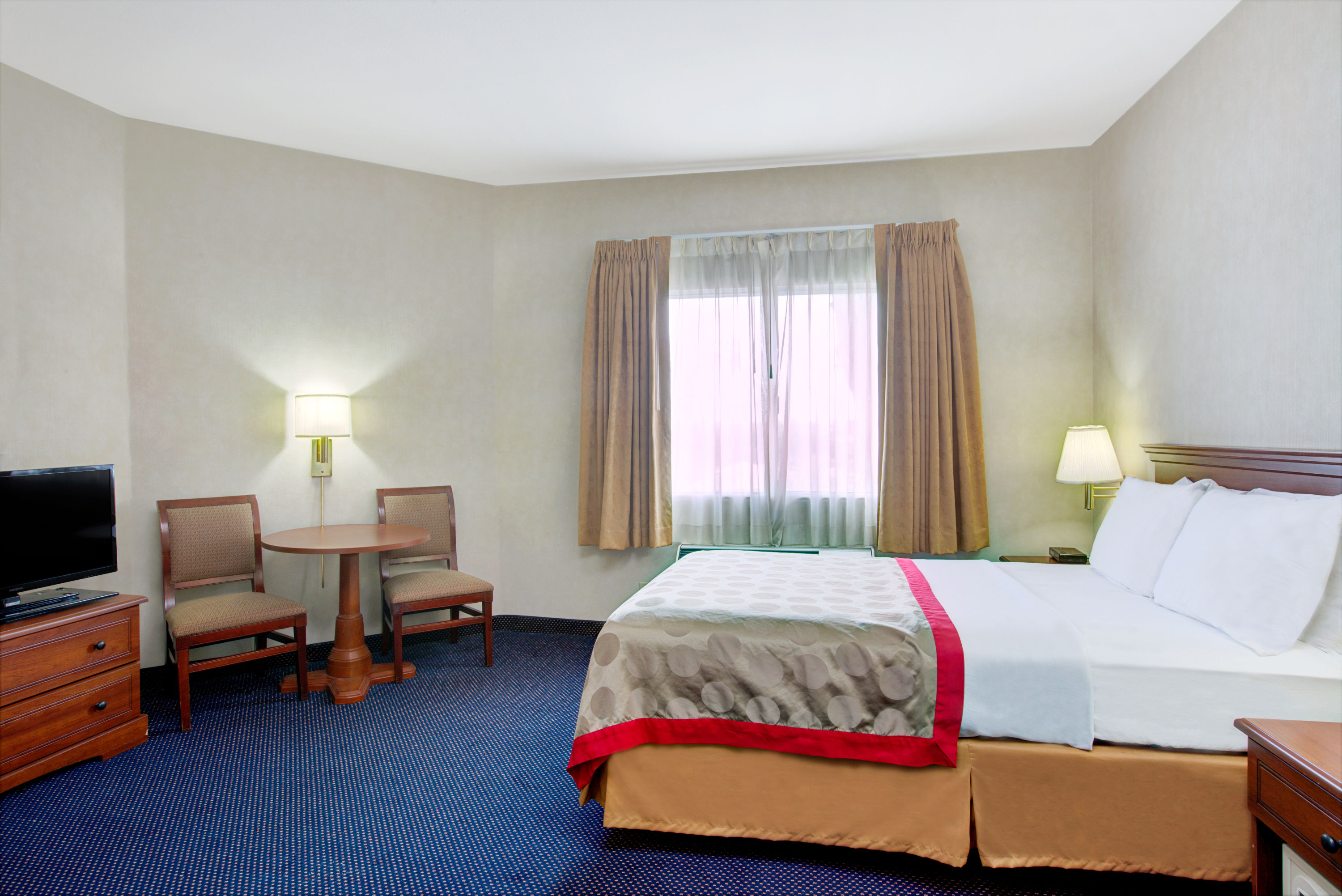 Guest room at the Ramada by Wyndham Hawthorne/LA Stadium in Hawthorne, California