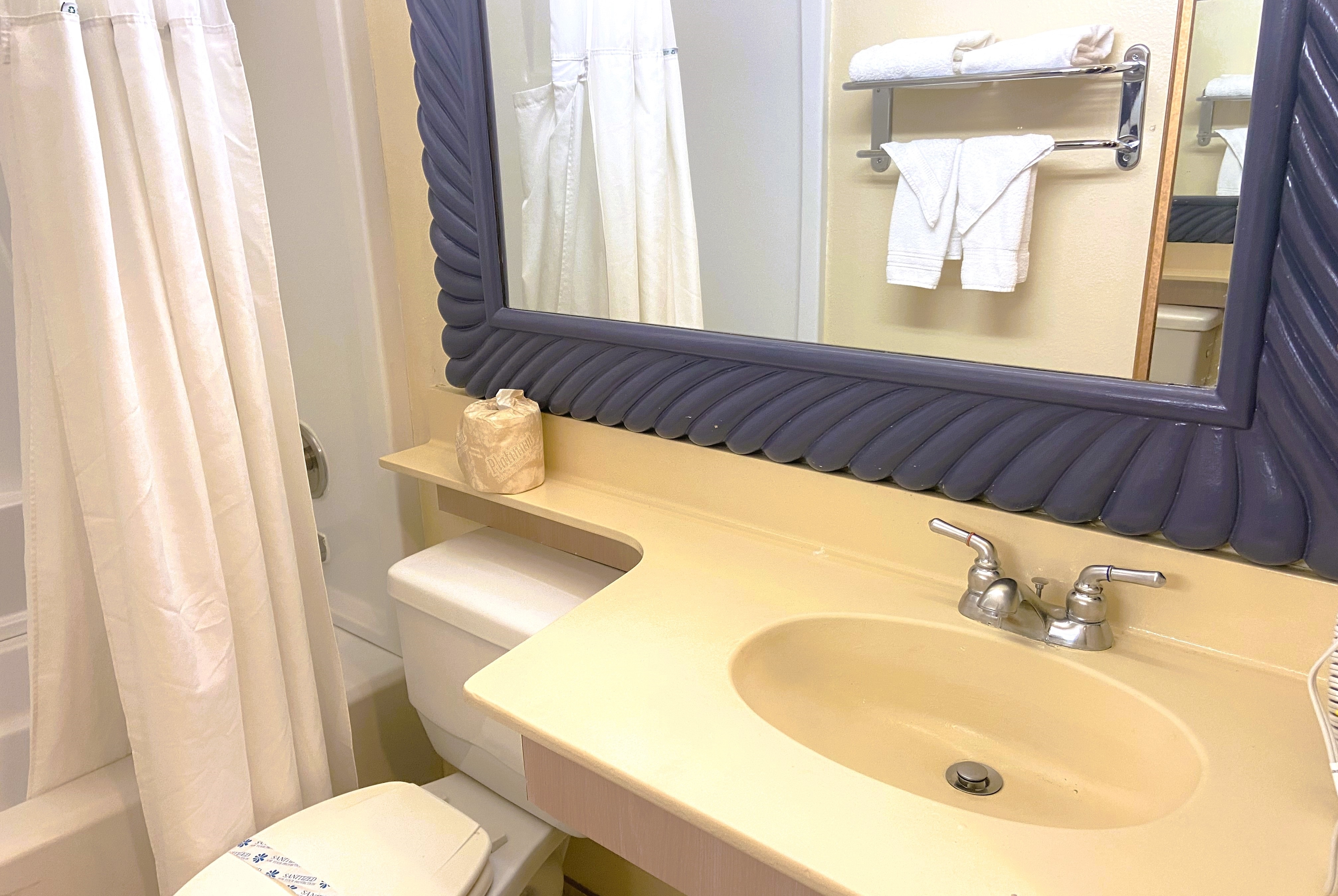 Guest room bath at the Ramada by Wyndham Los Angeles/Koreatown West in Los Angeles, California
