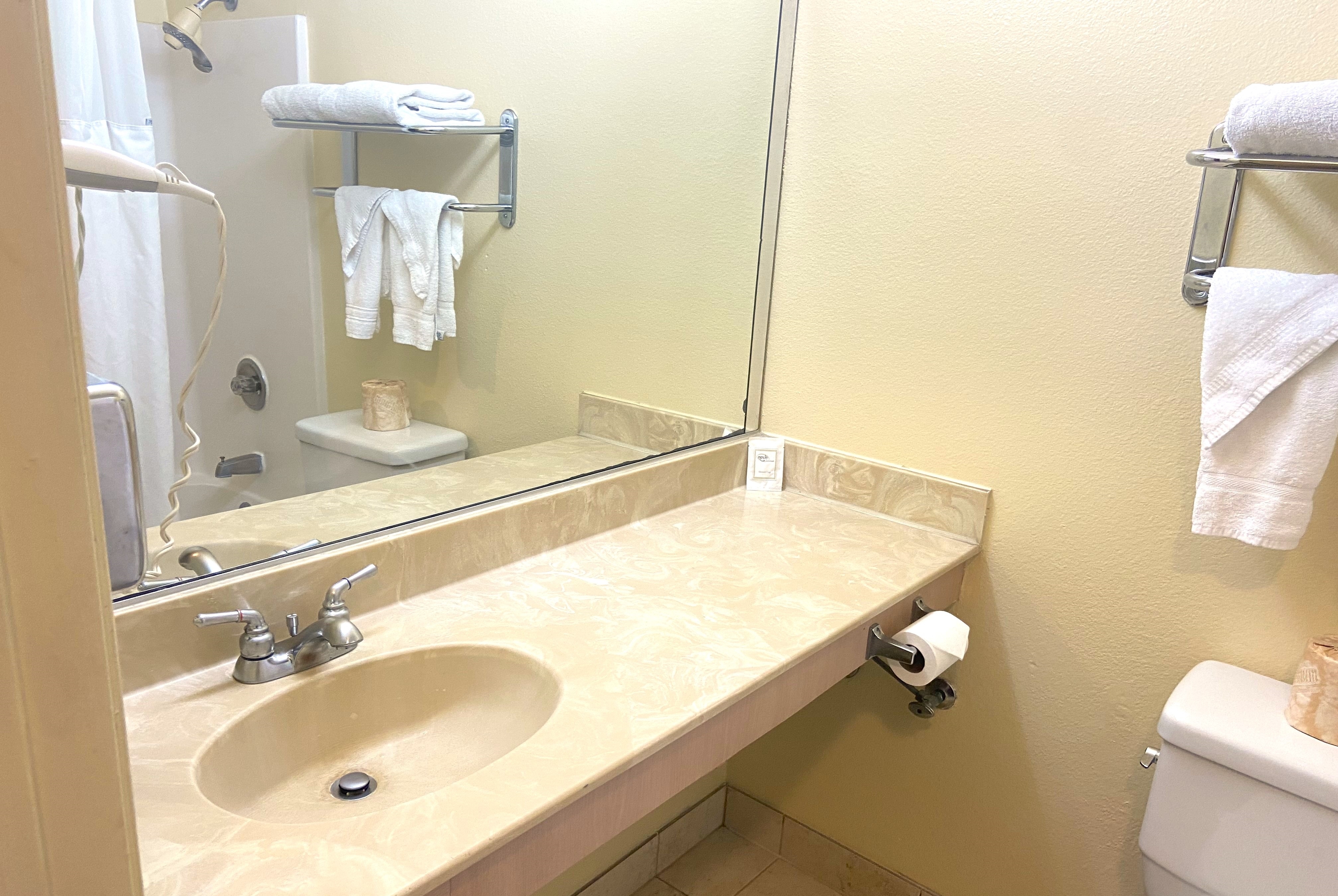 Guest room bath at the Ramada by Wyndham Los Angeles/Koreatown West in Los Angeles, California