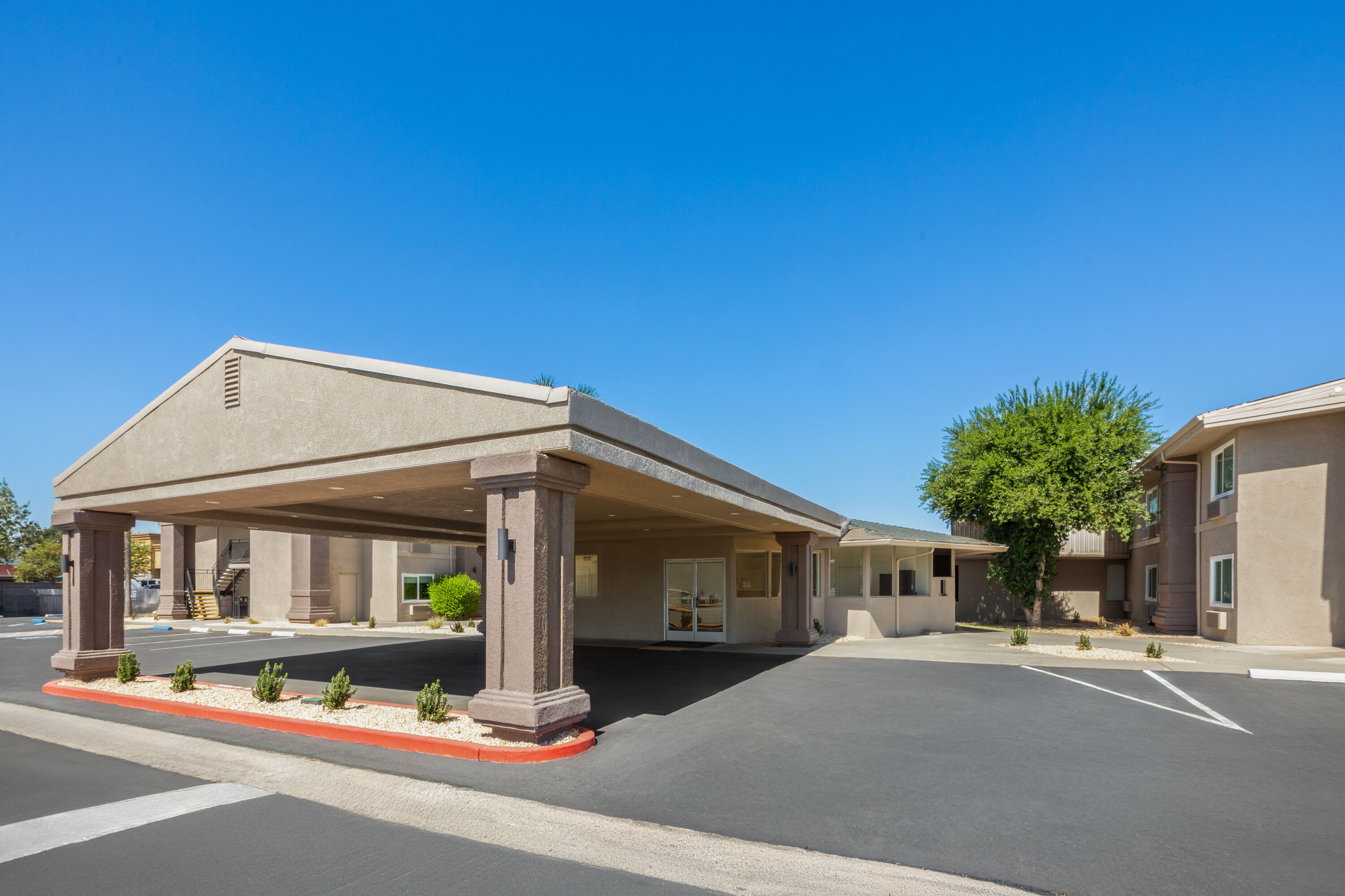 Exterior Day Image of Ramada by Wyndham Merced hotel in Merced, California