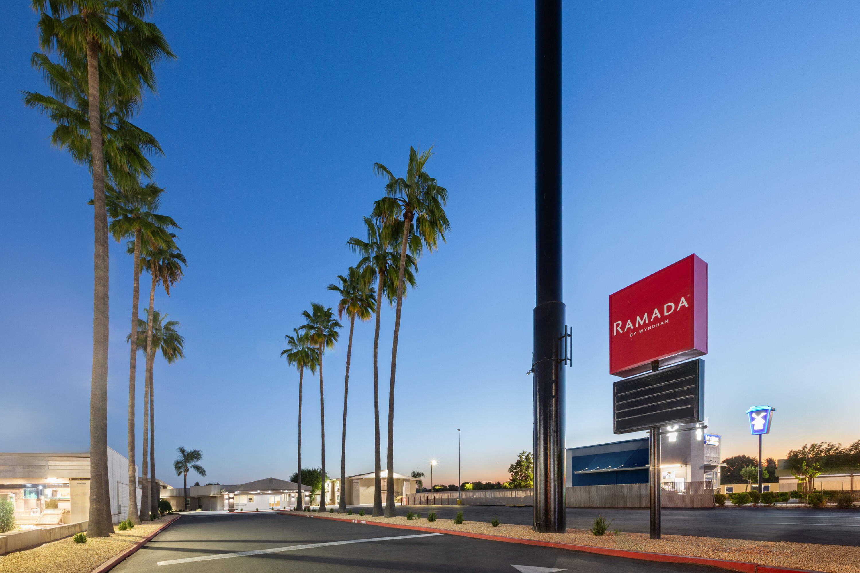 Exterior Dusk Image of Ramada by Wyndham Merced hotel in Merced, California