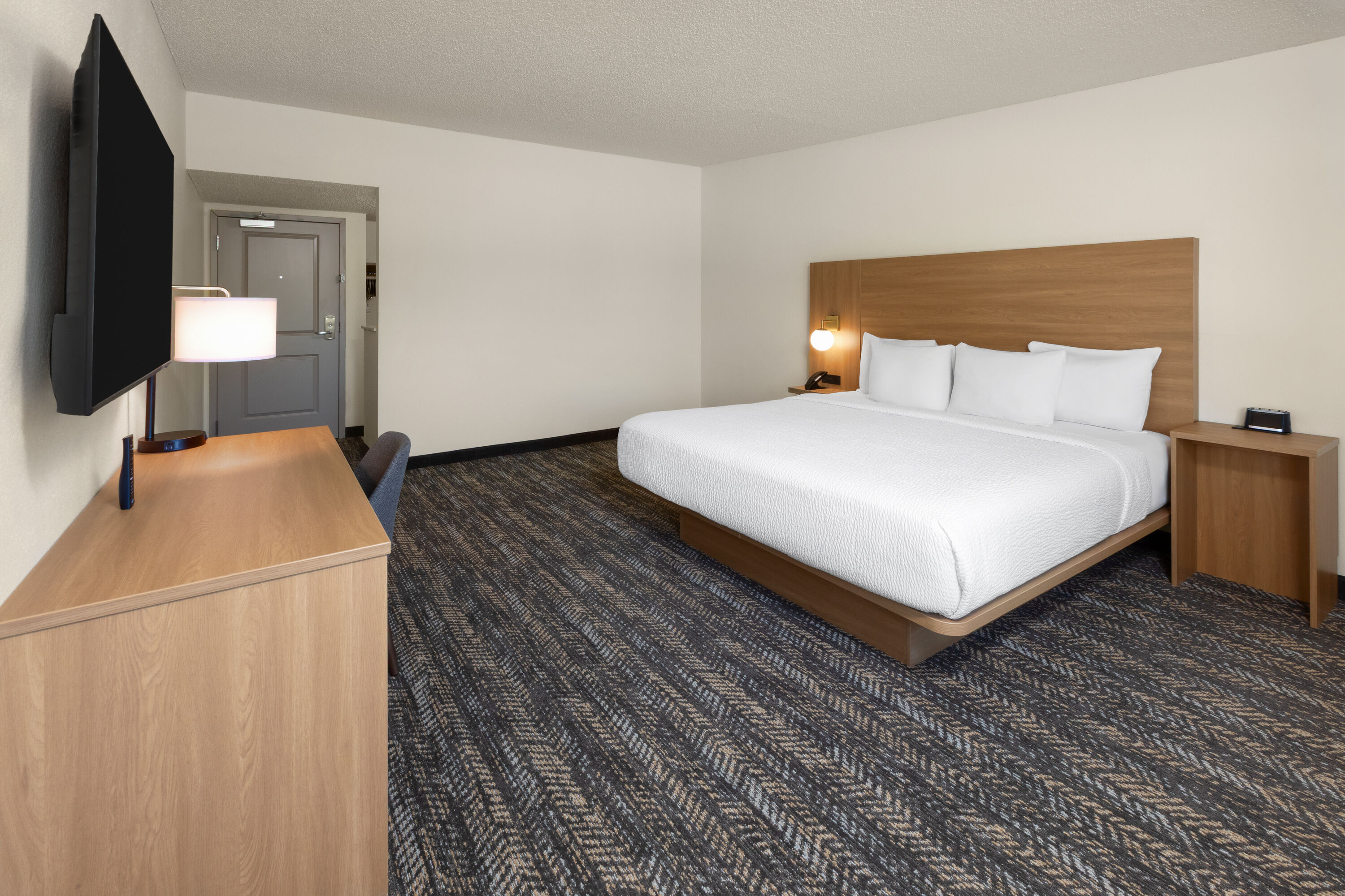 Guest room at the Ramada by Wyndham Merced in Merced, California