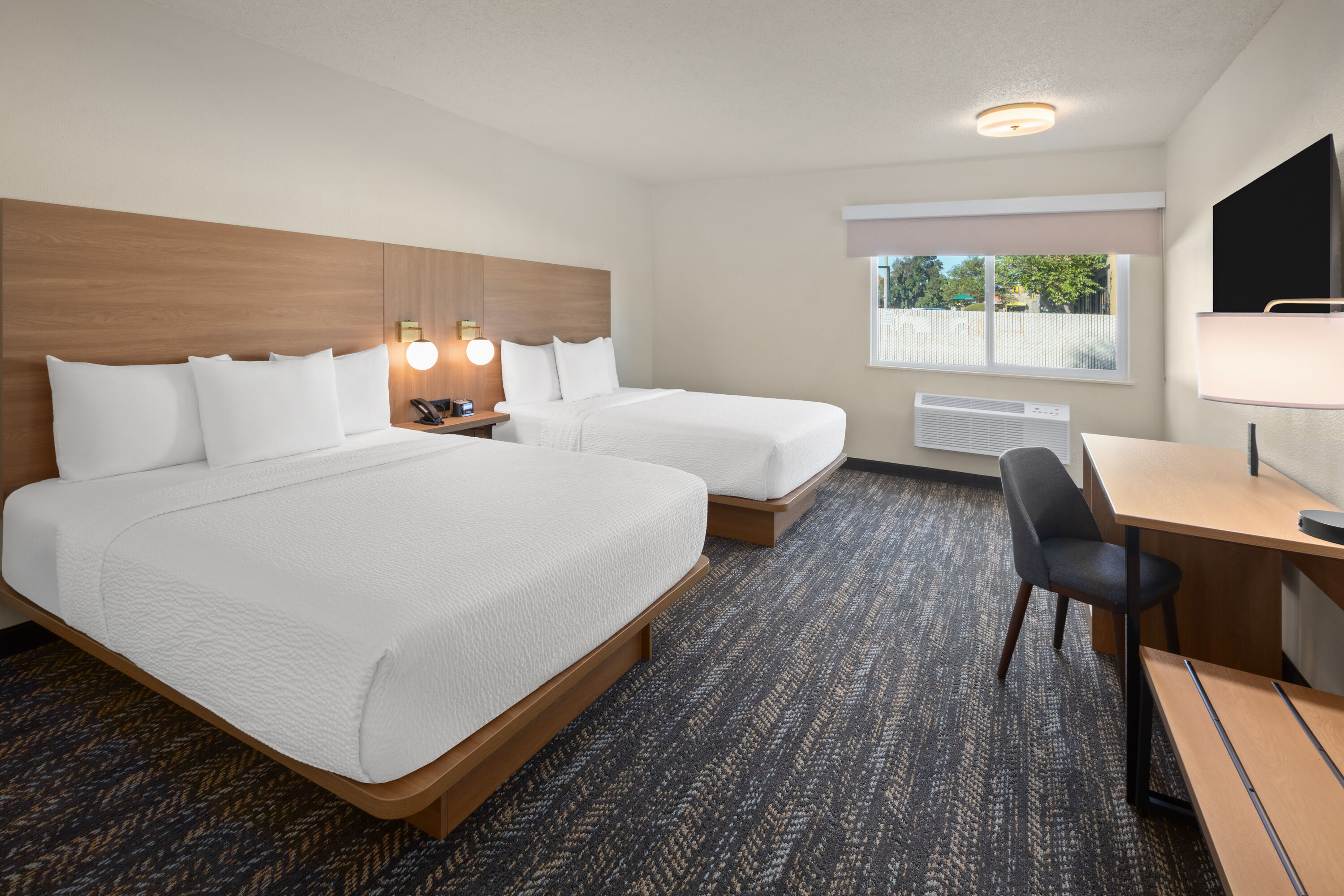 Guest room at the Ramada by Wyndham Merced in Merced, California