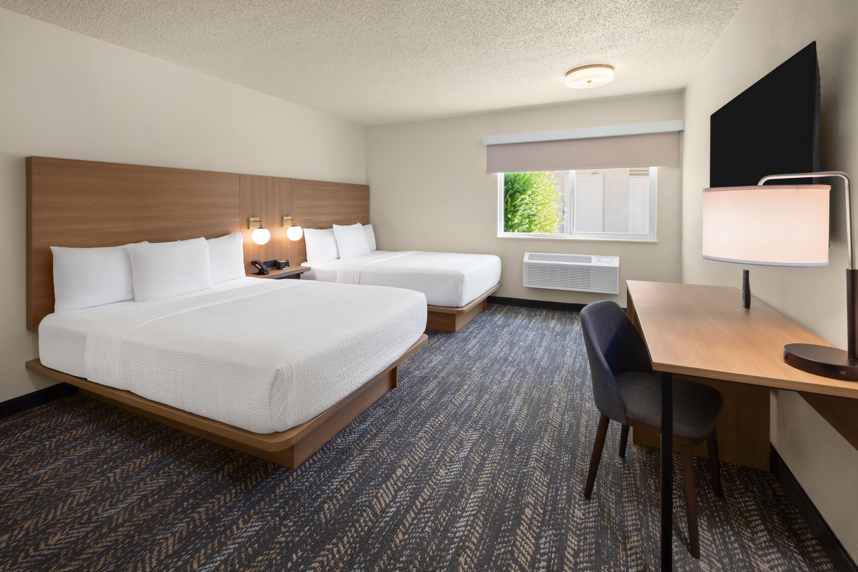 Guest room at the Ramada by Wyndham Merced in Merced, California