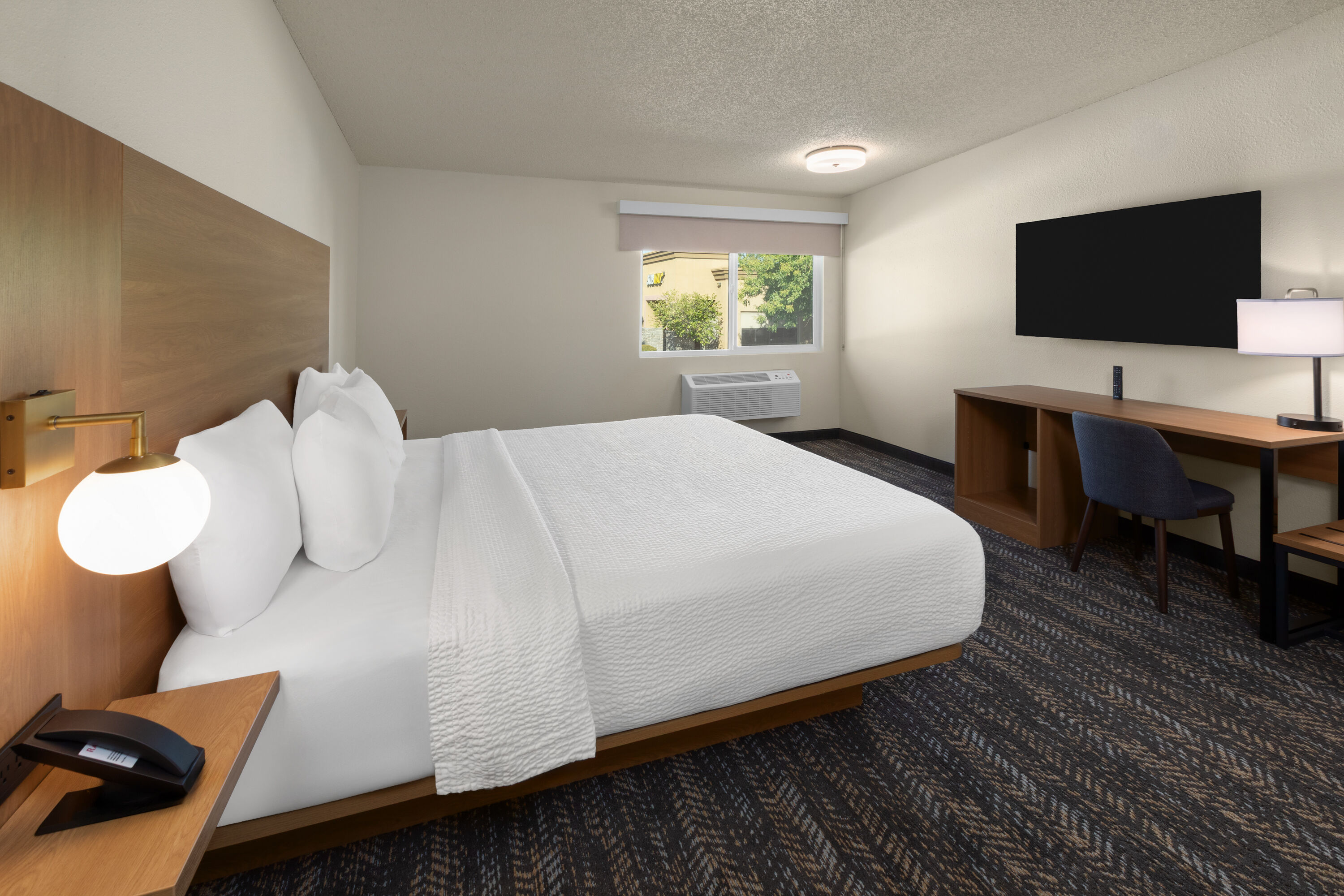 Guest room at the Ramada by Wyndham Merced in Merced, California