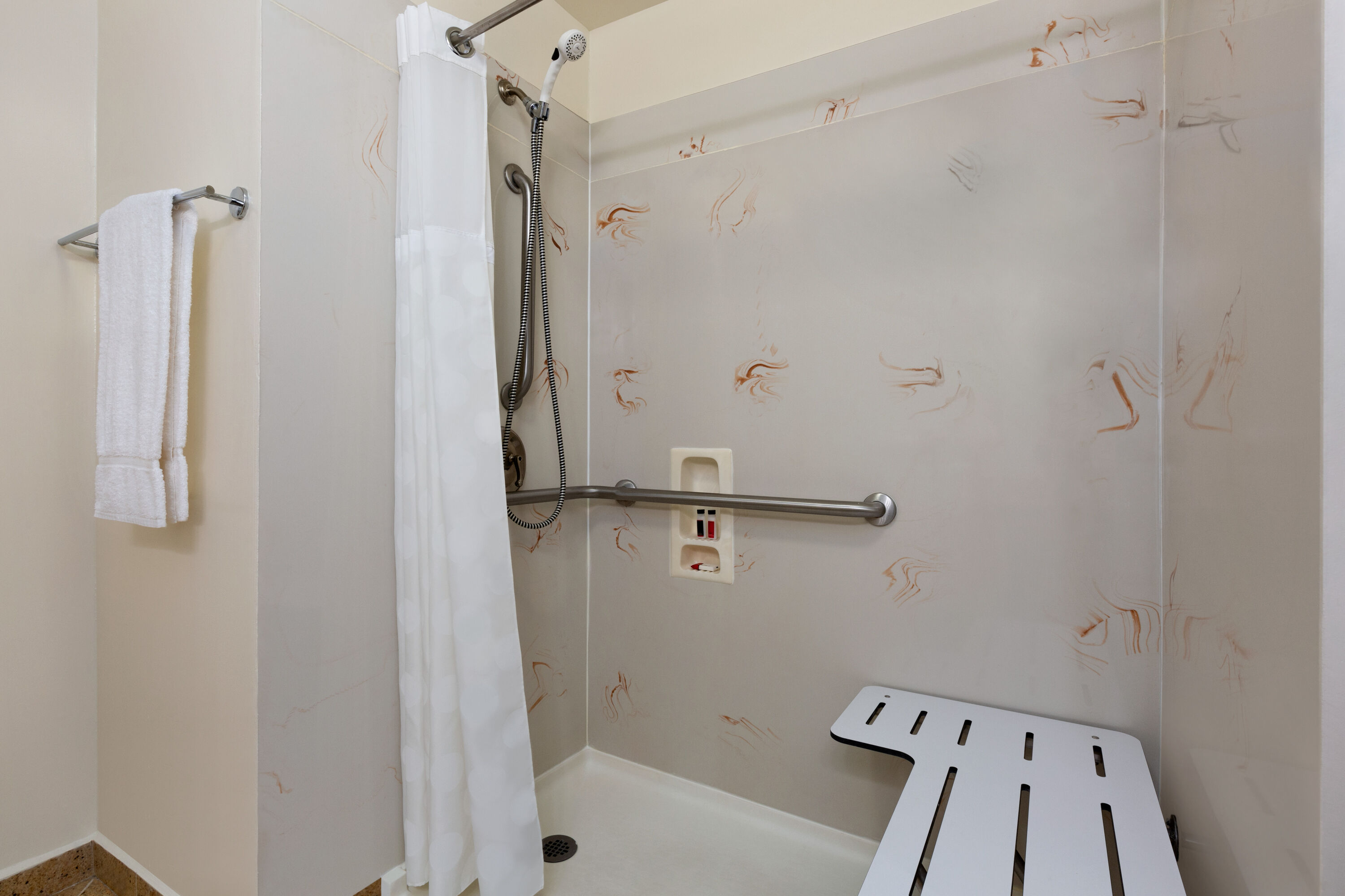 Guest room bath at the Ramada by Wyndham Oakland Downtown City Center in Oakland, California